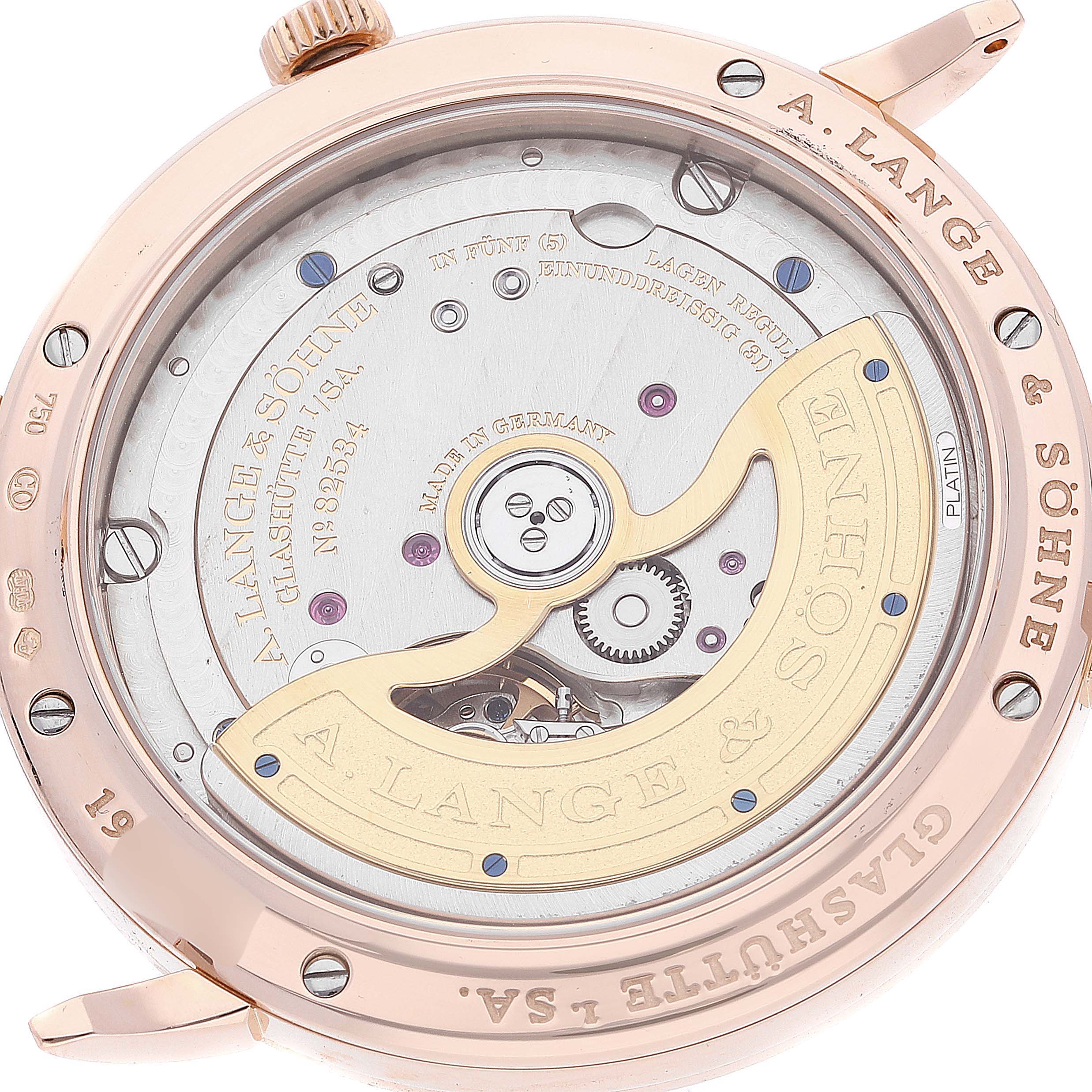 The image shows the backside of the Saxonia model by A. Lange & Söhne, highlighting the intricate watch movement and mechanical parts.
