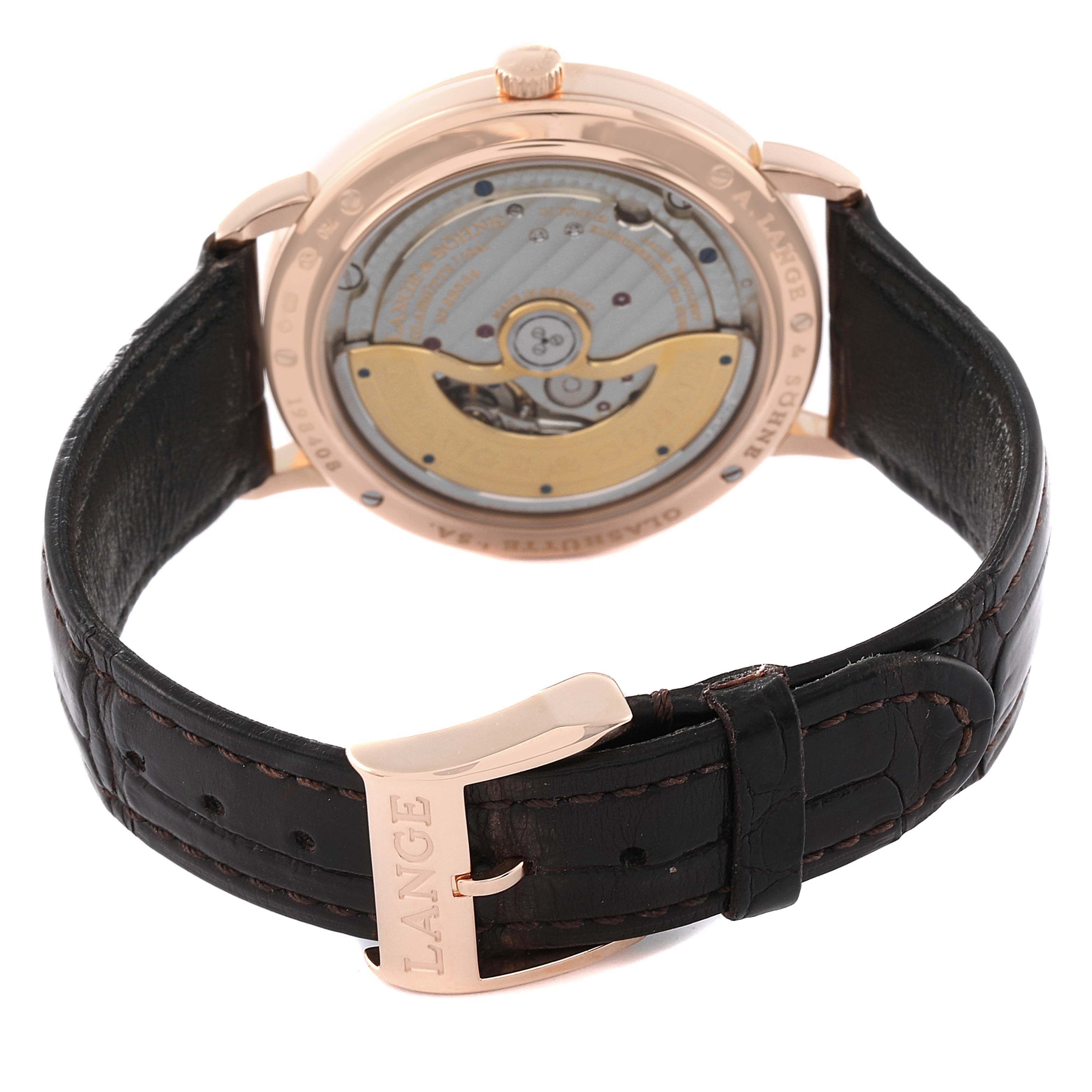 The image shows the rear view of the A. Lange & Sohne Saxonia watch, highlighting its movement and leather strap with buckle.