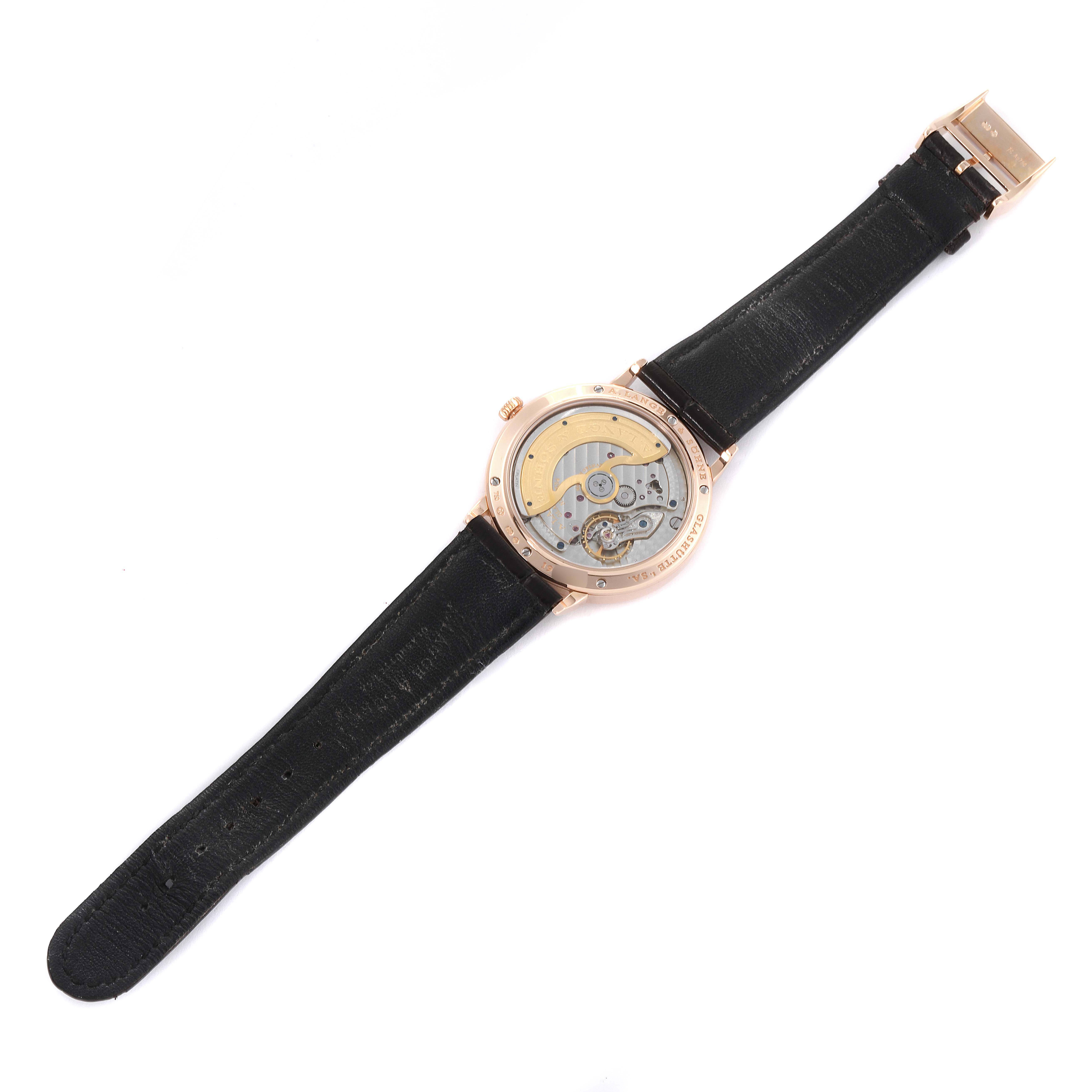 The image shows the back view of the A. Lange & Sohne Saxonia watch, displaying its movement and inner mechanisms.