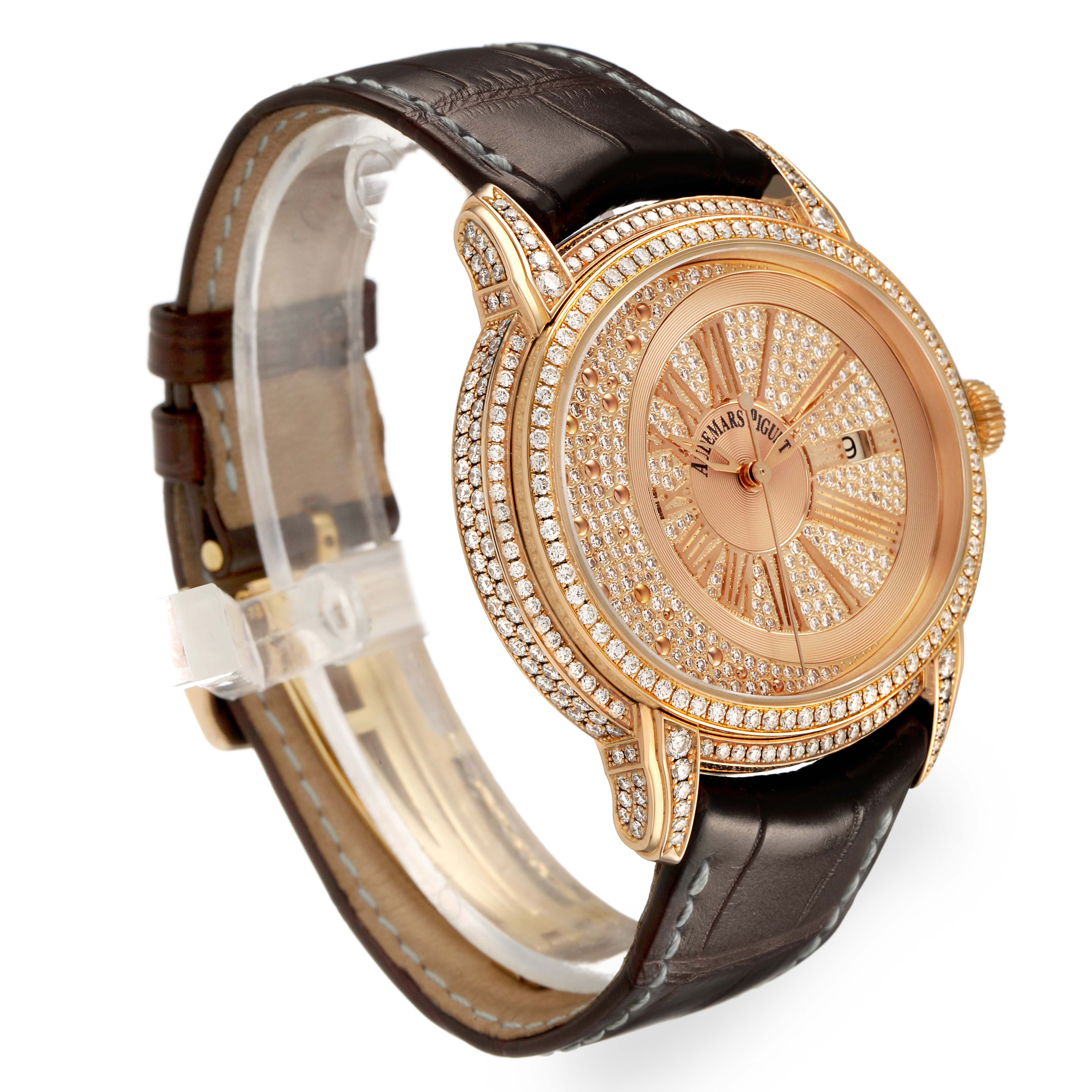The Audemars Piguet Millenary 15330OR.ZZ.D102CR.01 Women's Rose Gold Pink Dial watch is shown at a slight angle, highlighting its diamond-encrusted case, bezel, and brown leather strap.