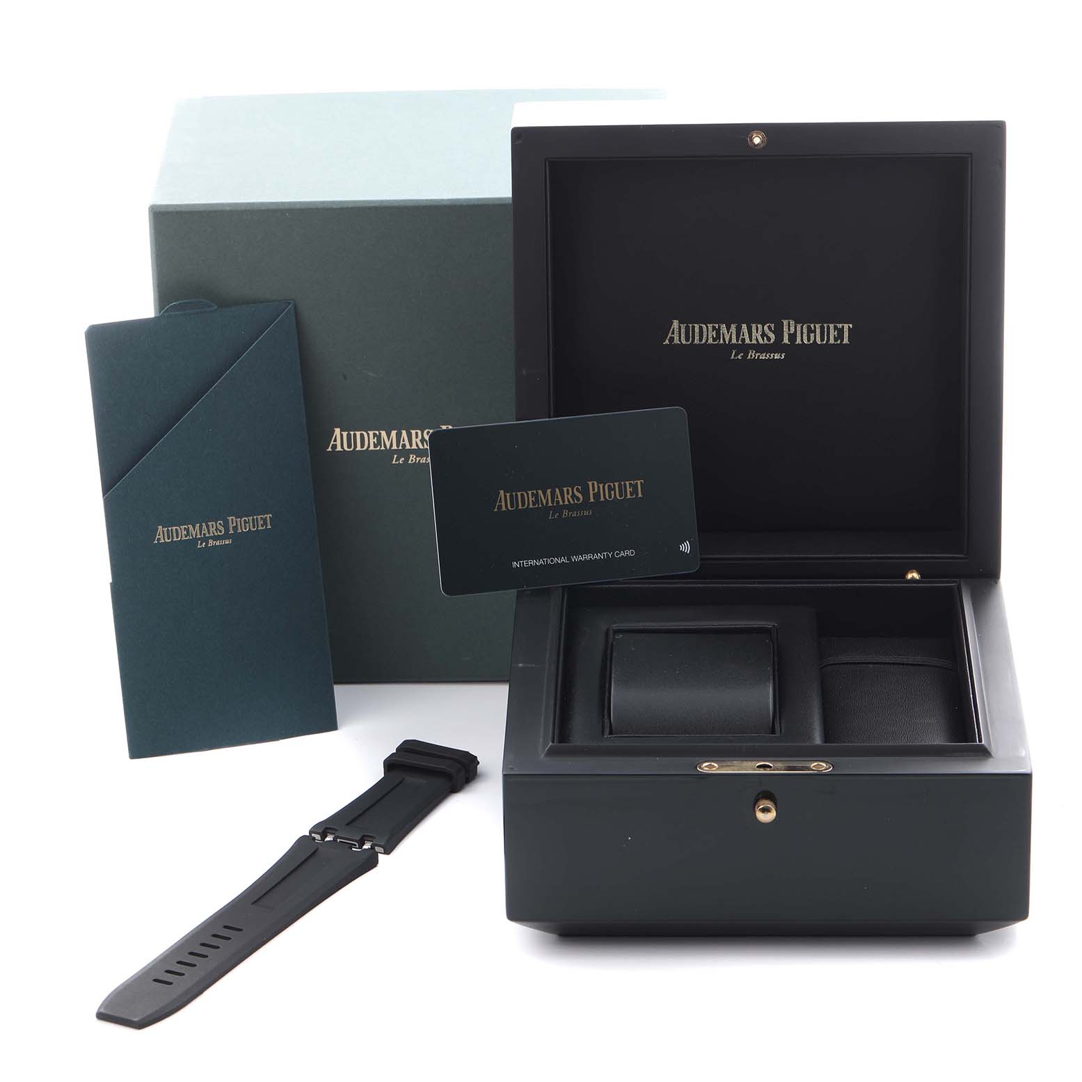 The image shows a Royal Oak Offshore watch box by Audemars Piguet, with a strap, warranty card, and packaging at a front angle.