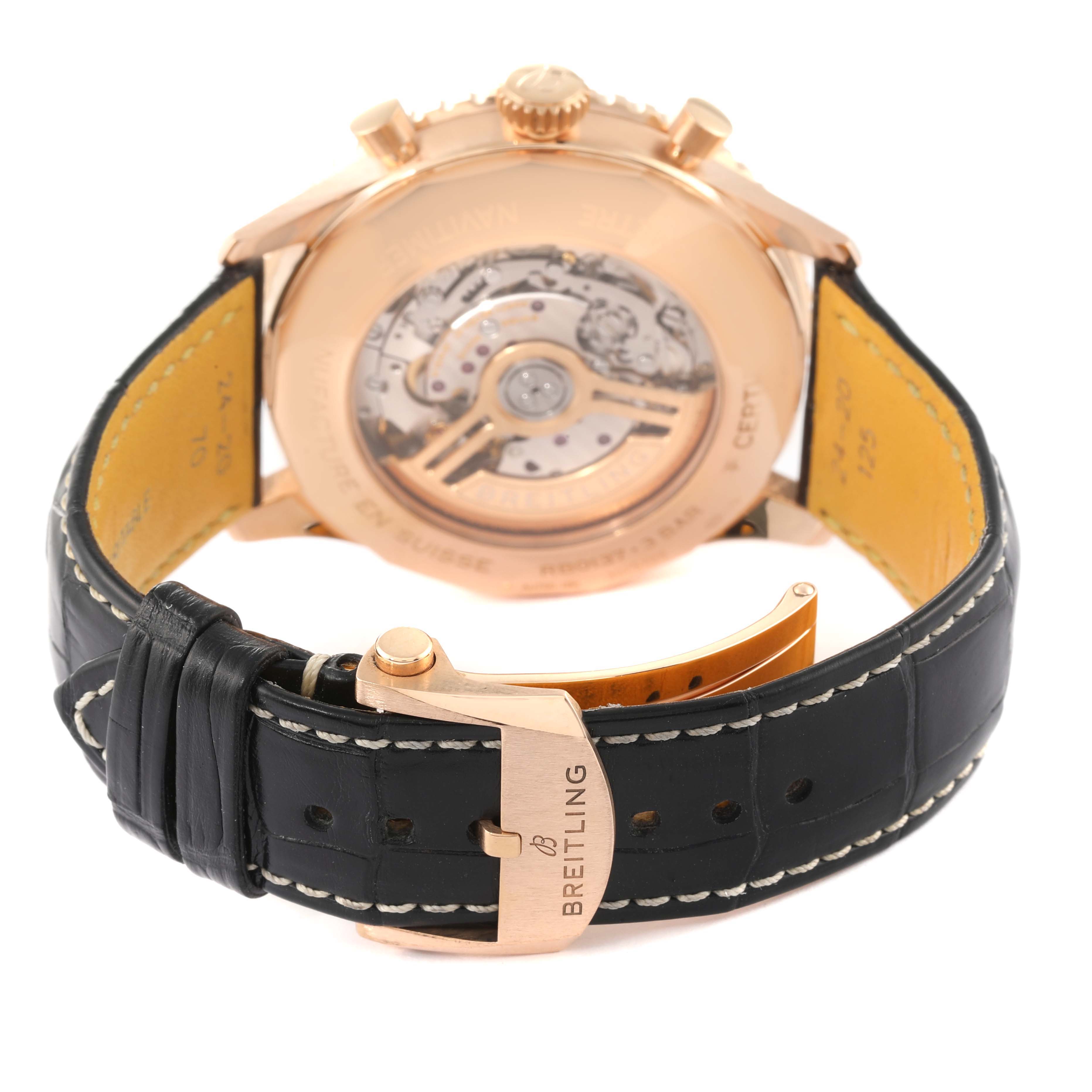 The image shows the back view of a Breitling Navitimer RB0137 Men's Rose Gold Silver Dial RB0137 Men's Rose Gold Silver Dial watch, highlighting the movement and black leather strap with a Breitling clasp.