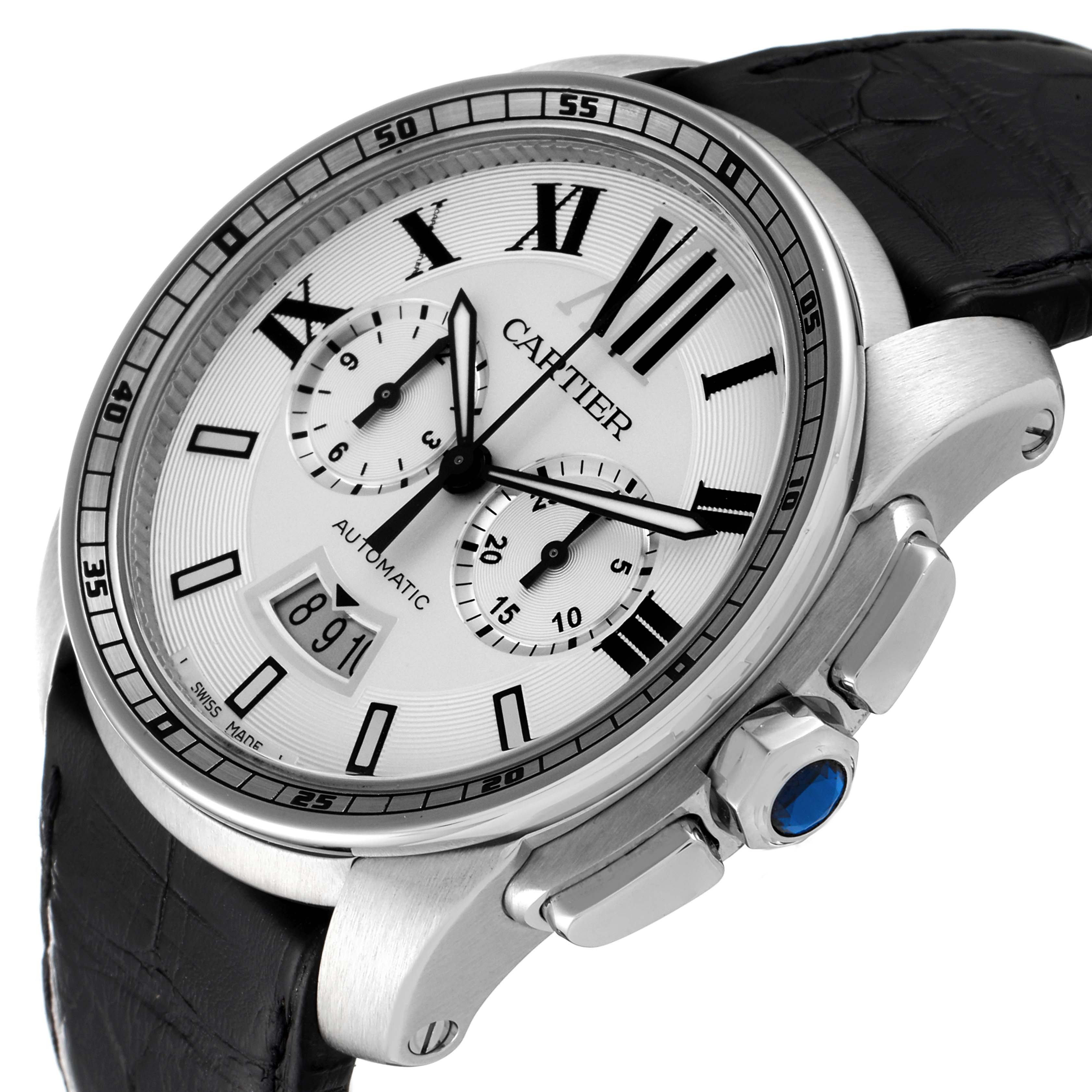 This image shows a three-quarter view of a Calibre de Cartier watch by Cartier, highlighting its dial, case, crown, pushers, and leather strap.