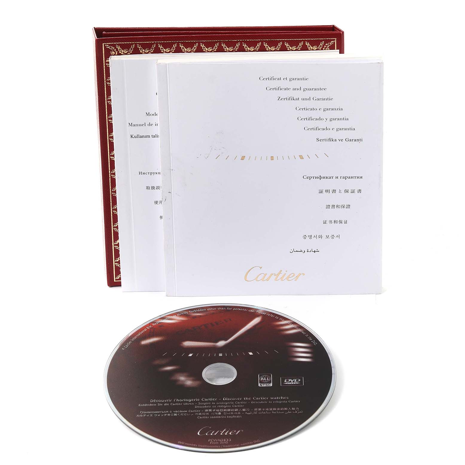 The image shows the Cartier Tank Solo W1018755 Women
s Steel and Gold (two tone) Silver Dial W1018755 Women
s Steel and Gold (two tone) Silver Dial model with its accompanying red box, user manuals, certificates, and a DVD.