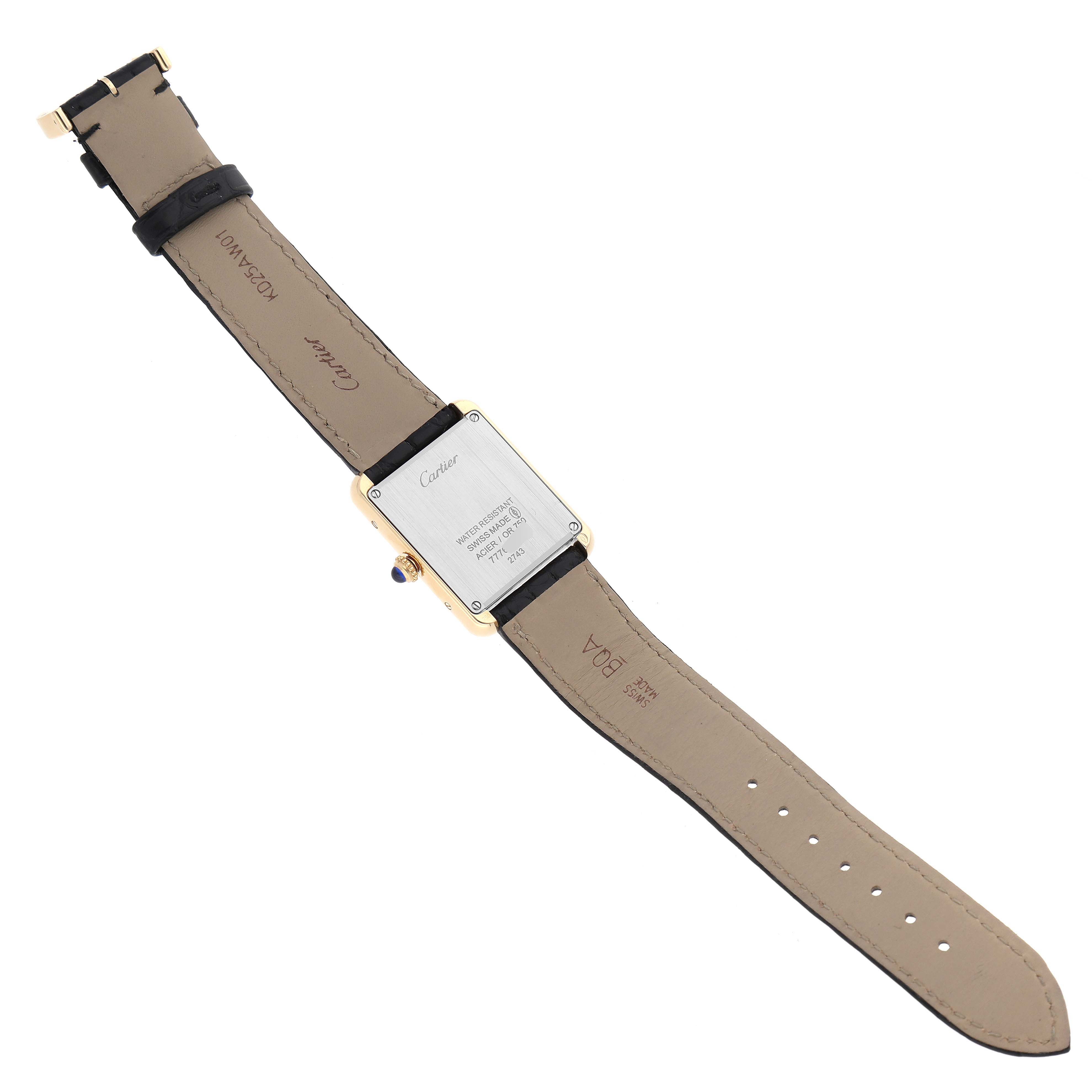 The image shows the back case and strap of the Cartier Tank Solo W1018755 Women
s Steel and Gold (two tone) Silver Dial W1018755 Women
s Steel and Gold (two tone) Silver Dial watch, displaying its engravings and clasp.