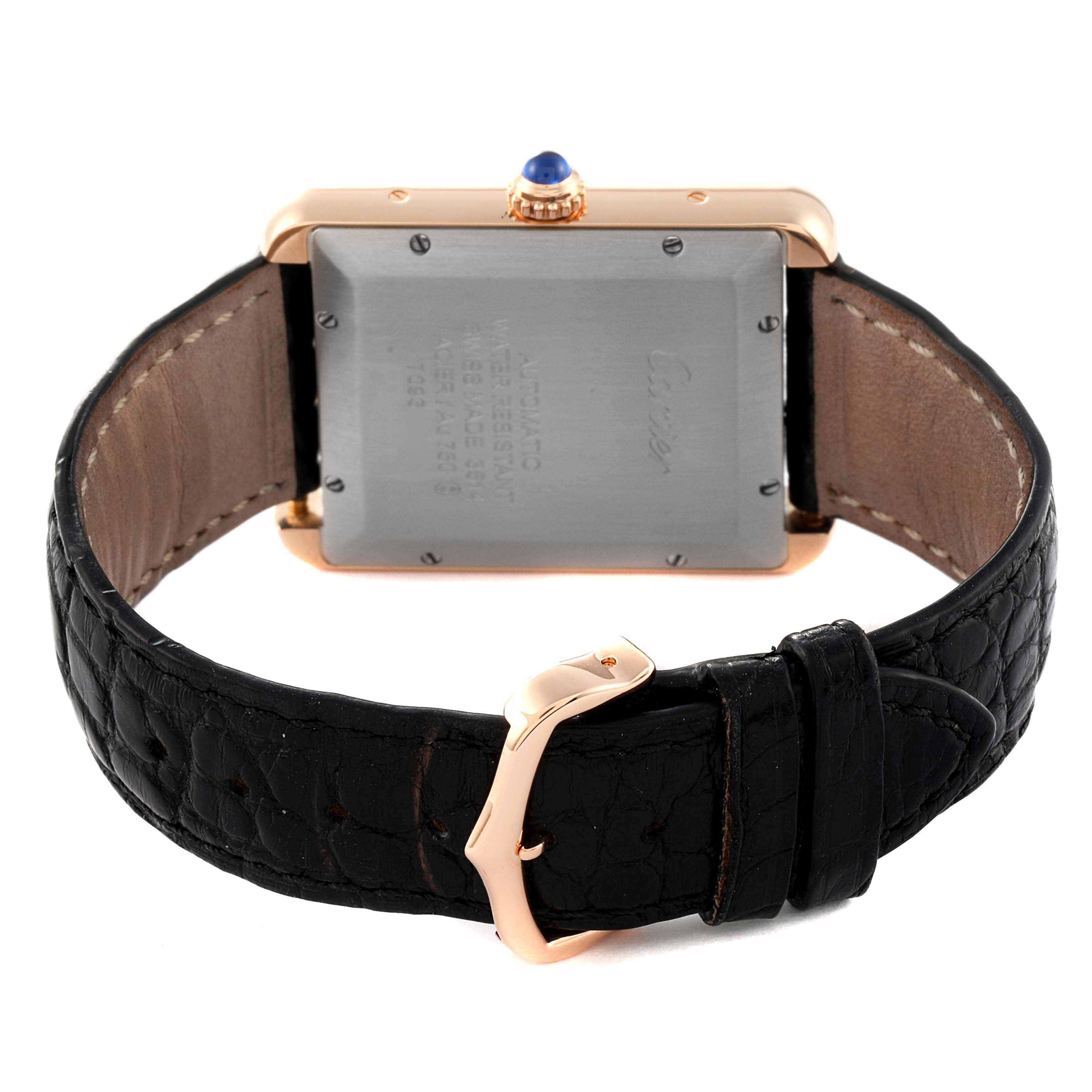 This image shows the back view of a Tank Solo model watch by Cartier, featuring the case back, crown, and leather strap with buckle.