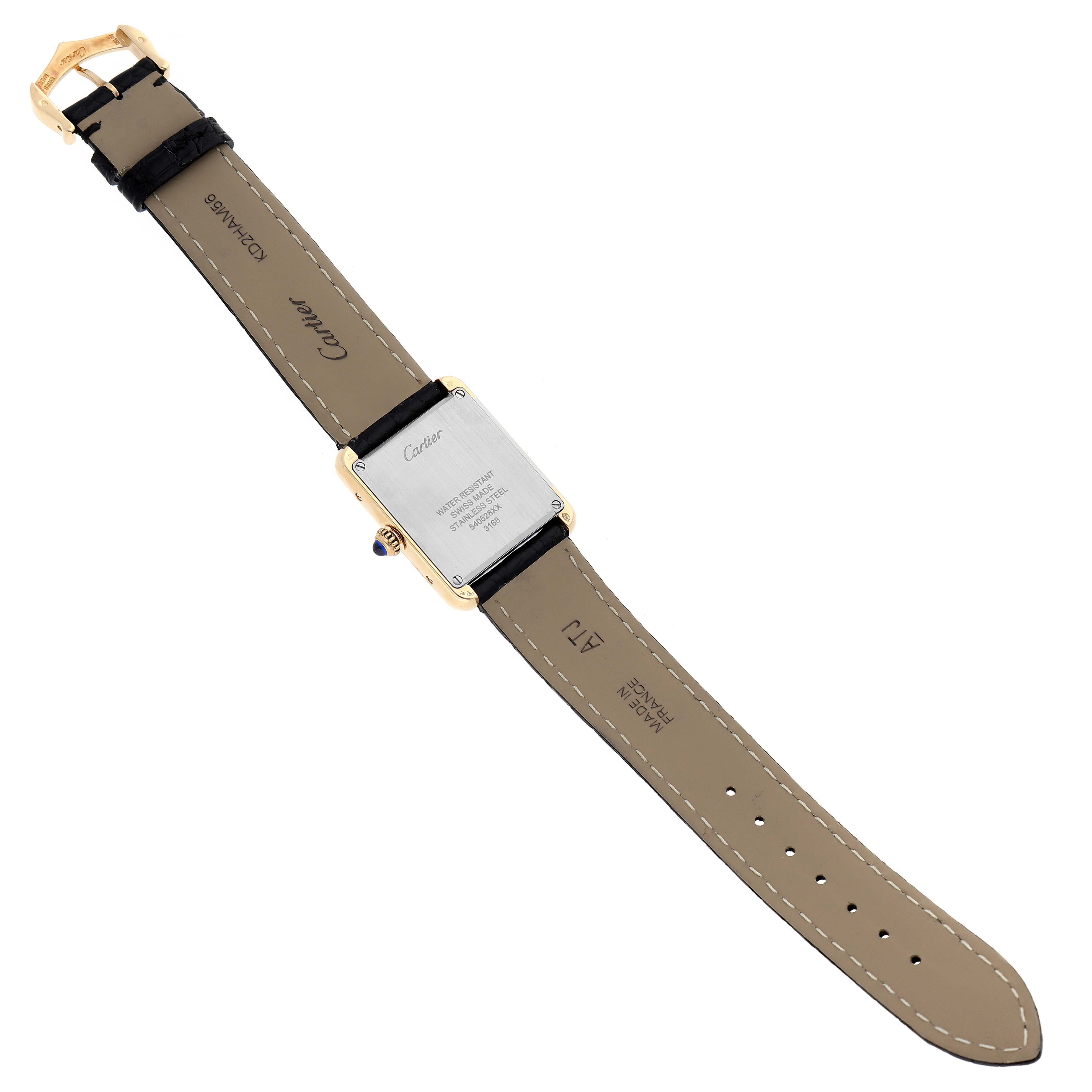 The image shows the back and the strap of the Cartier Tank Solo W5200002 Women
s Steel and Gold (two tone) Silver Dial W5200002 Women
s Steel and Gold (two tone) Silver Dial watch laid flat.