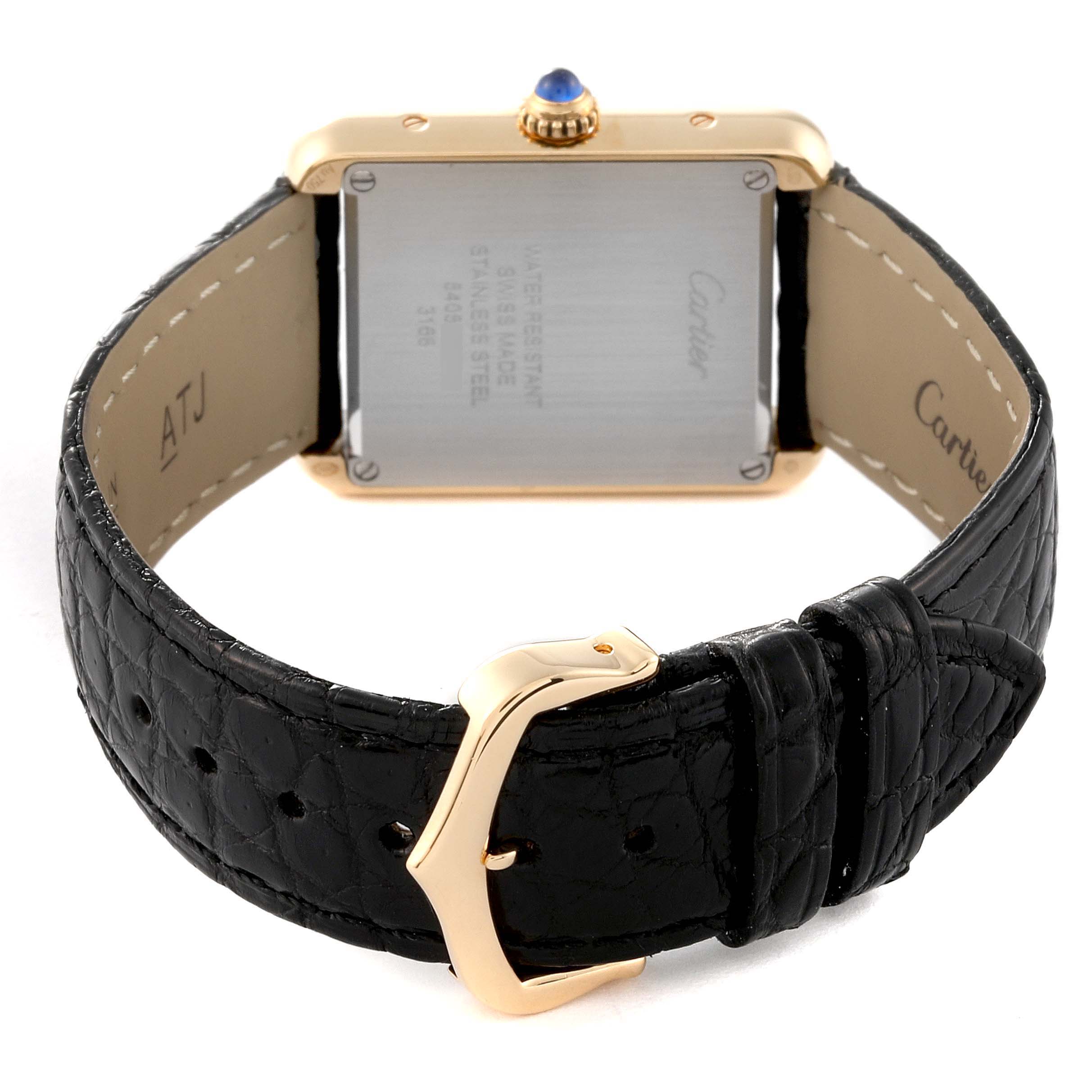 The image shows the back side of the Cartier Tank Solo W5200002 Women
s Steel and Gold (two tone) Silver Dial W5200002 Women
s Steel and Gold (two tone) Silver Dial watch, including its case back, crown, and black leather strap with a gold buckle.