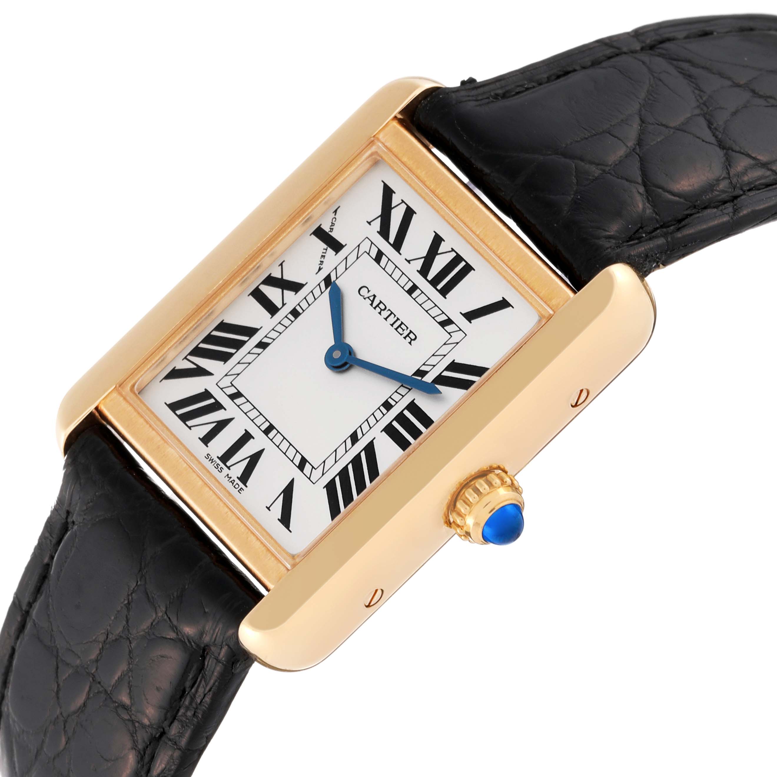 This image shows a close-up, angled view of the Cartier Tank Solo W5200002 Women
s Steel and Gold (two tone) Silver Dial W5200002 Women
s Steel and Gold (two tone) Silver Dial watch, highlighting its face, bezel, and part of the black leather strap.