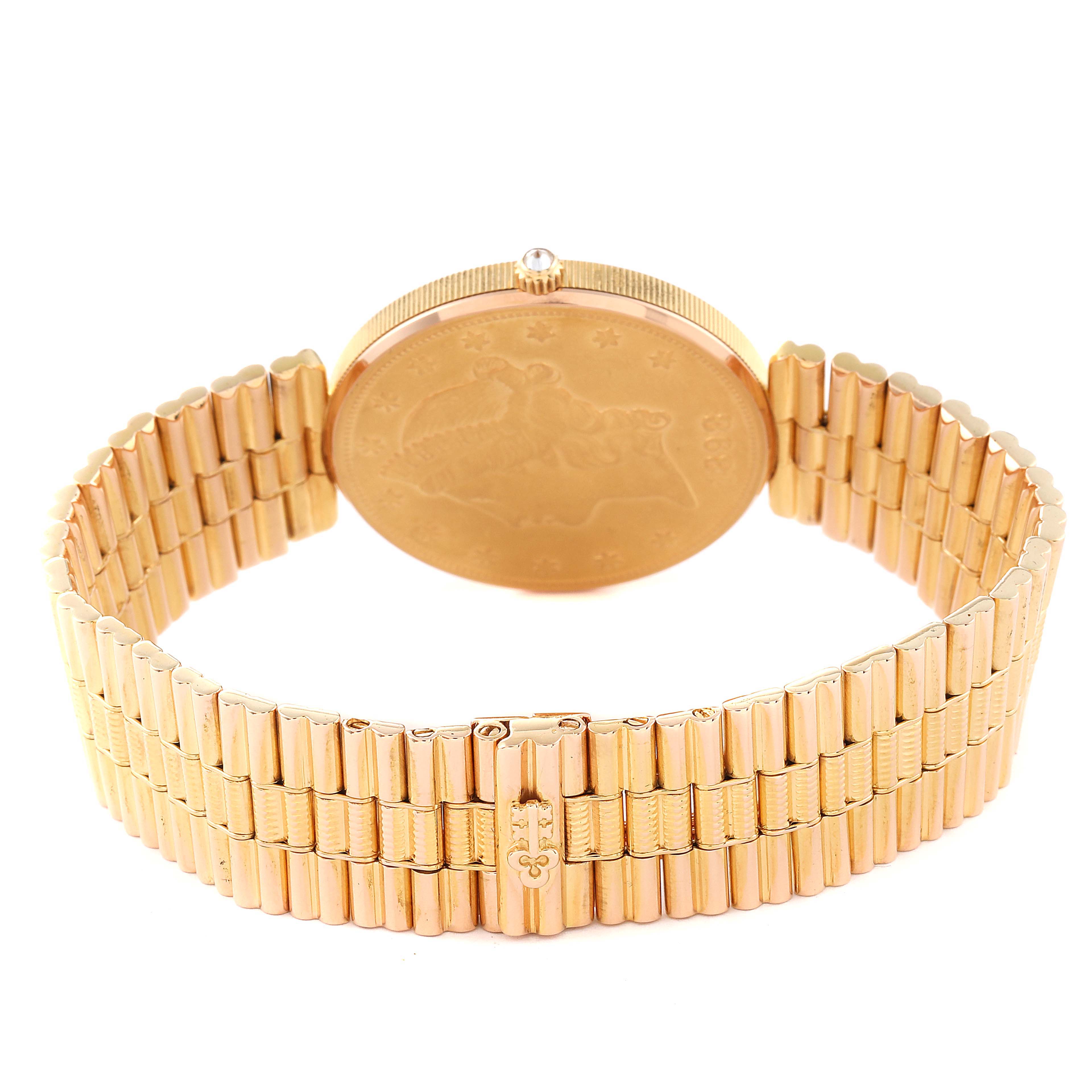 The image shows a rear angle of the Corum Coin Watch 1898 Men's Yellow Gold Champagne Dial 1898 Men's Yellow Gold Champagne Dial model, highlighting the case back and gold bracelet.