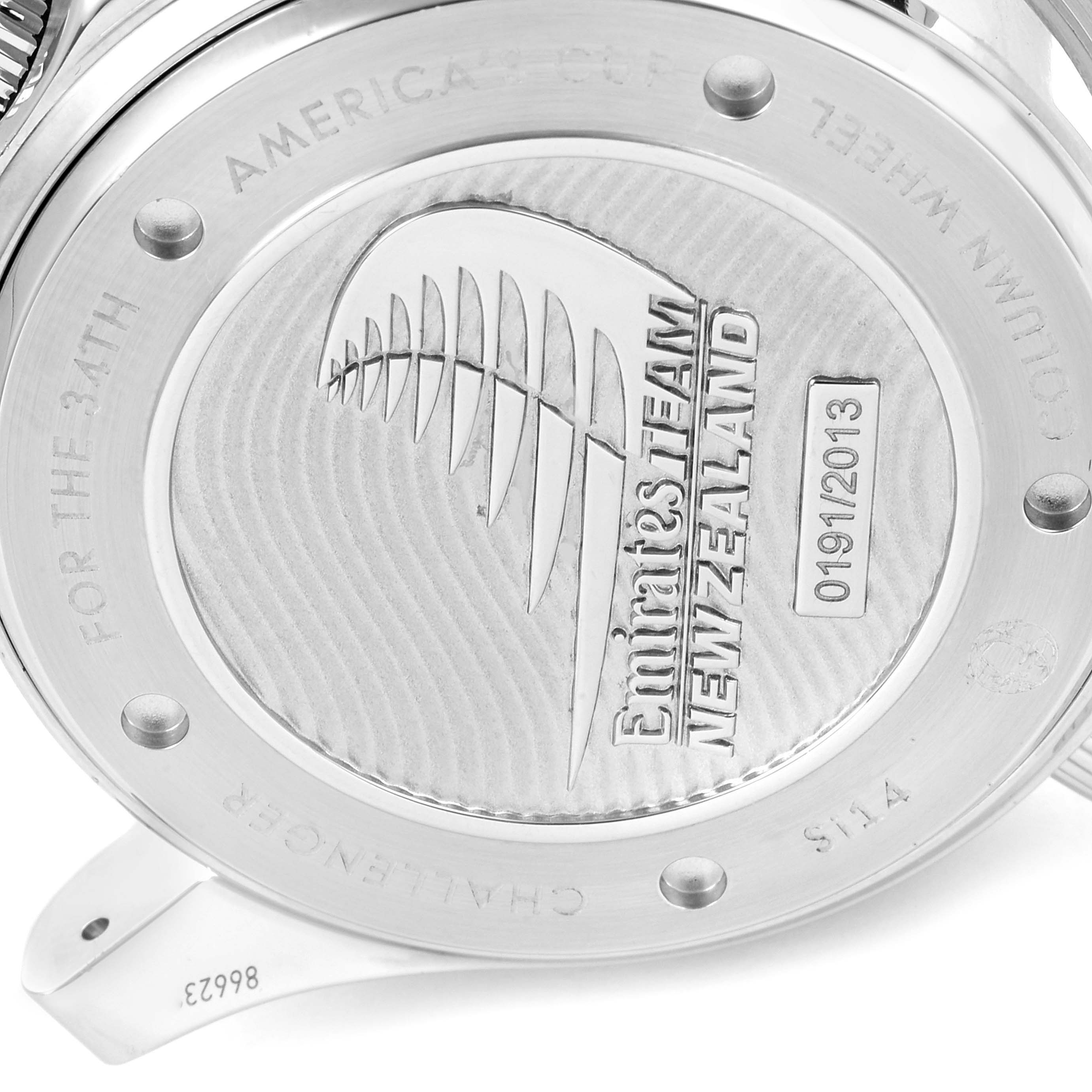 The image shows the case back of an Omega Seamaster 212.32.44.50.01.001 Men's Stainless Steel Black Dial 212.32.44.50.01.001 Men's Stainless Steel Black Dial watch featuring "Emirates Team New Zealand" engraving.