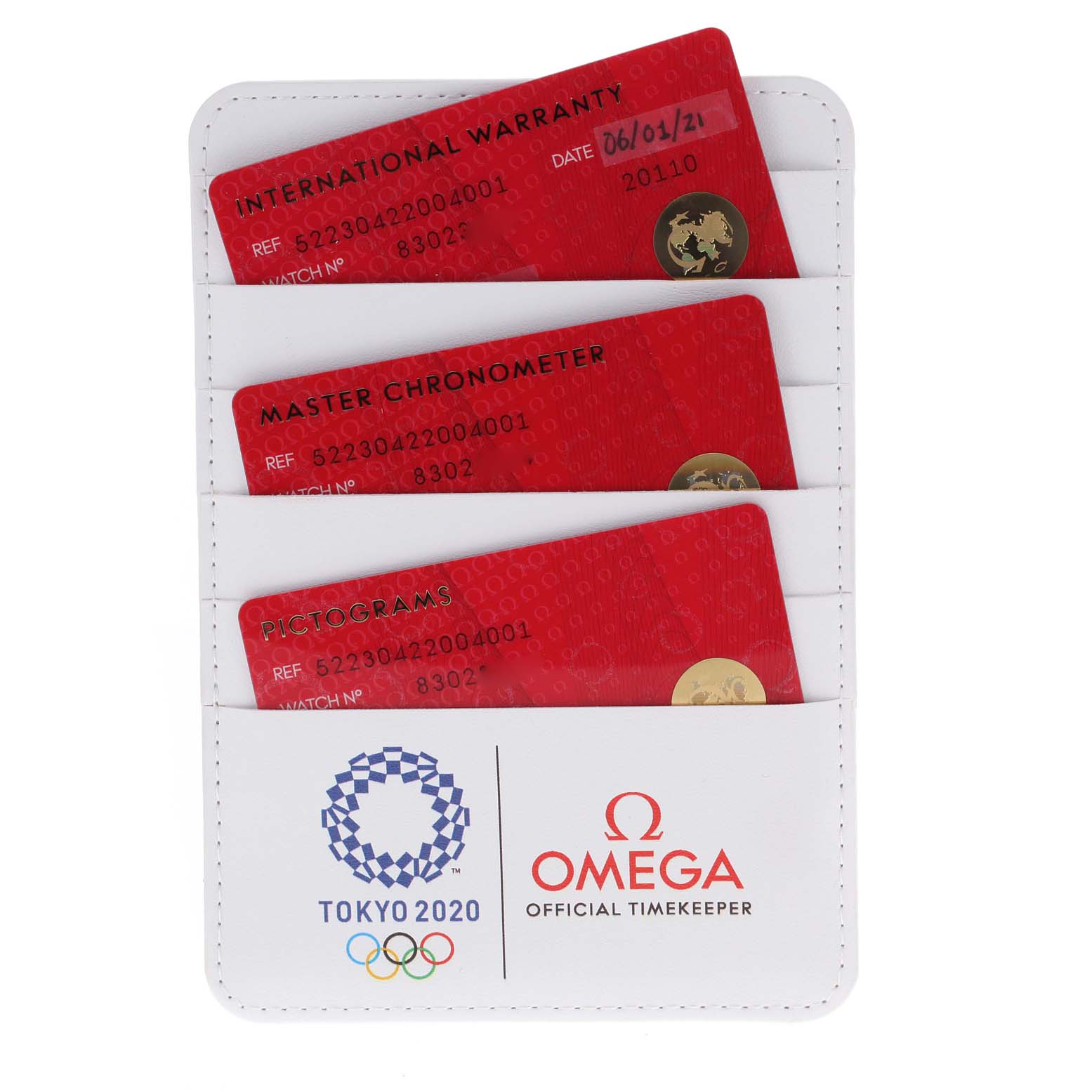 The image shows warranty cards and certification cards for an Omega Seamaster 522.30.42.20.04.001 Men's Stainless Steel White Dial 522.30.42.20.04.001 Men's Stainless Steel White Dial watch in a white holder.