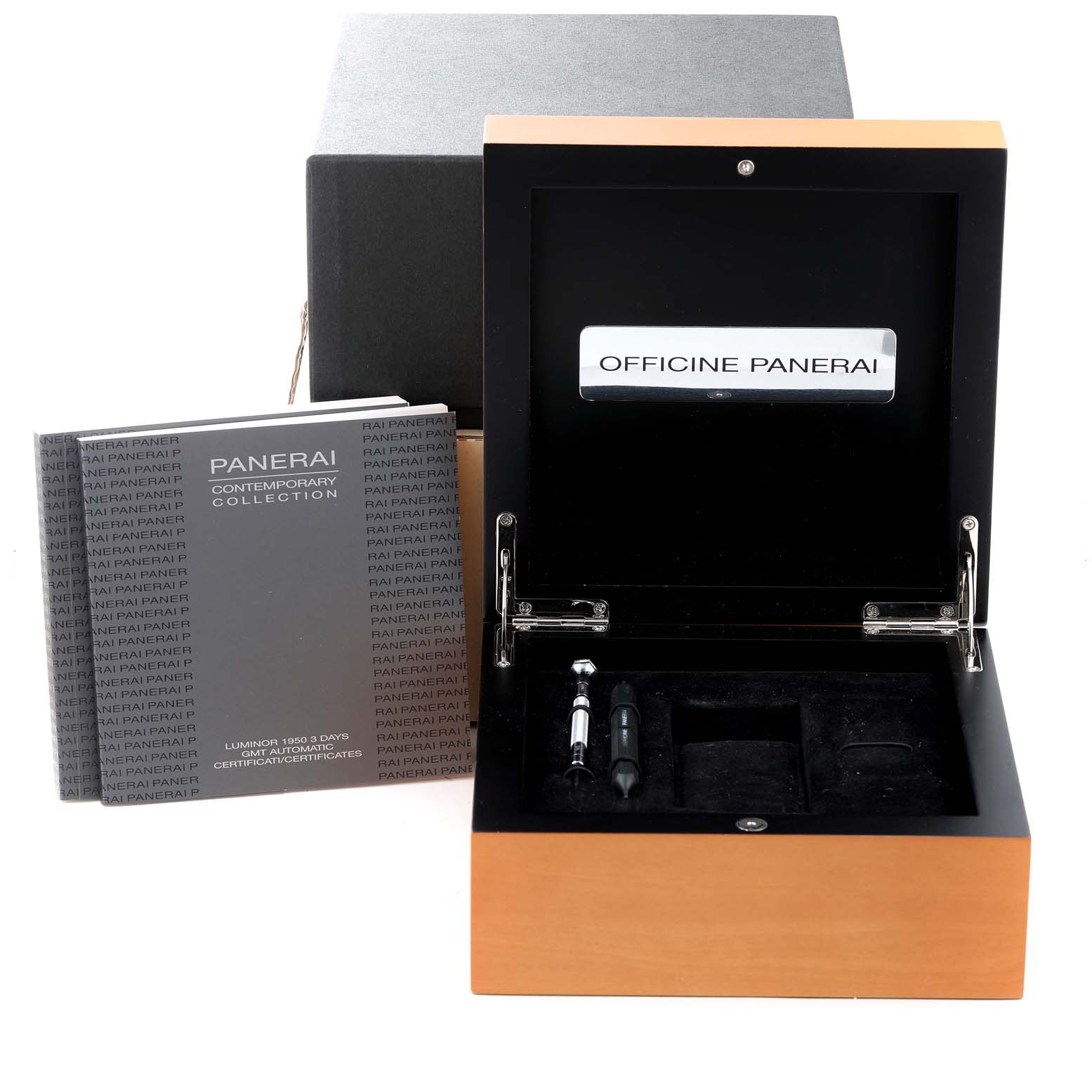 The image shows the open wooden box of a Panerai Luminor PAM00320 Men
s Stainless Steel Black Dial PAM00320 Men
s Stainless Steel Black Dial, along with manuals and included tools.