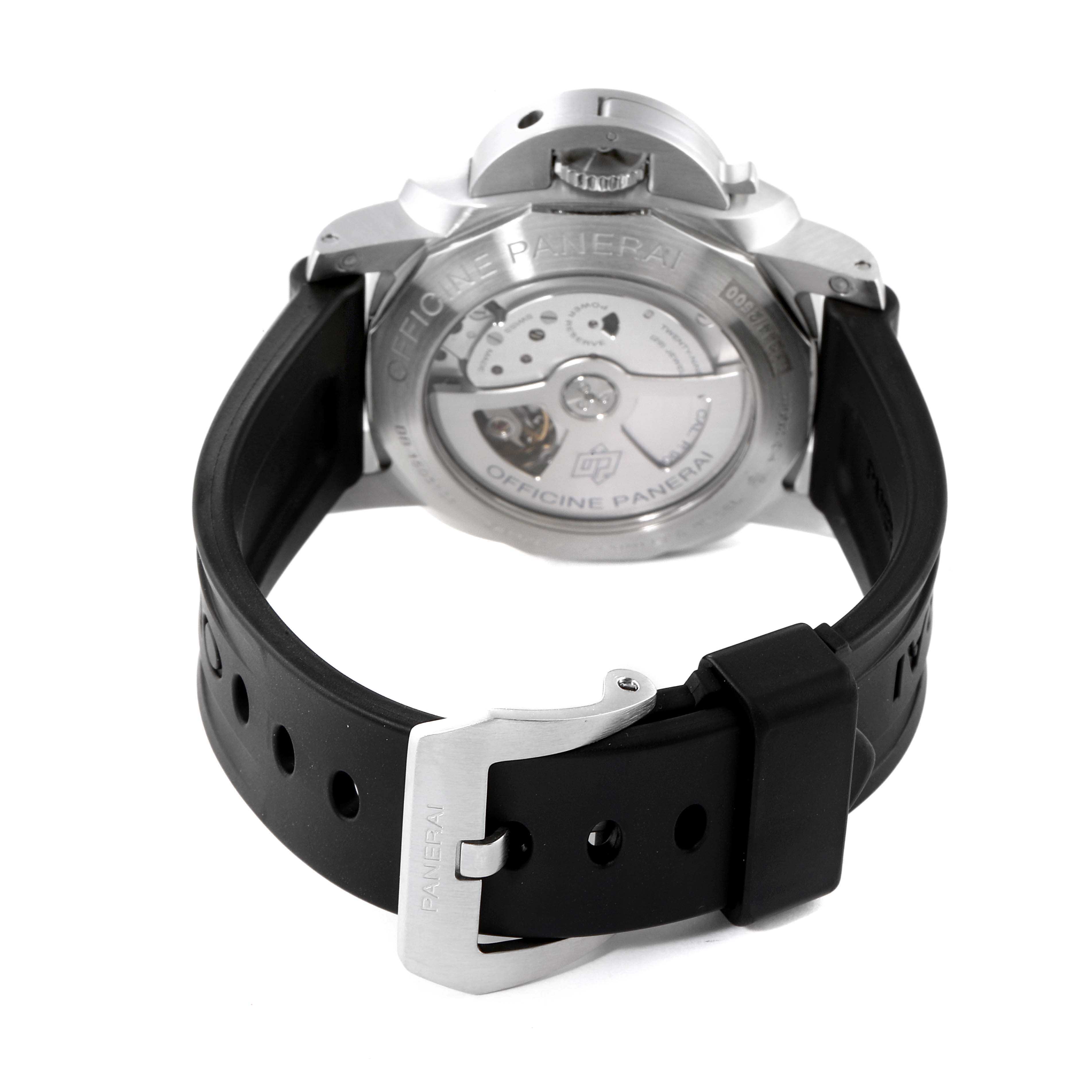 The image shows the back view of a Panerai Luminor PAM00320 Men
s Stainless Steel Black Dial PAM00320 Men
s Stainless Steel Black Dial watch, highlighting the exposed mechanism and the black rubber strap with a buckle.