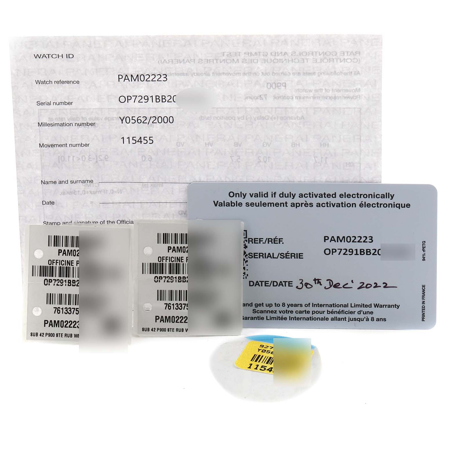 This image shows documentation and warranty cards for the Panerai Submersible PAM02223 Men's Stainless Steel White Dial PAM02223 Men's Stainless Steel White Dial model, including serial and reference details.