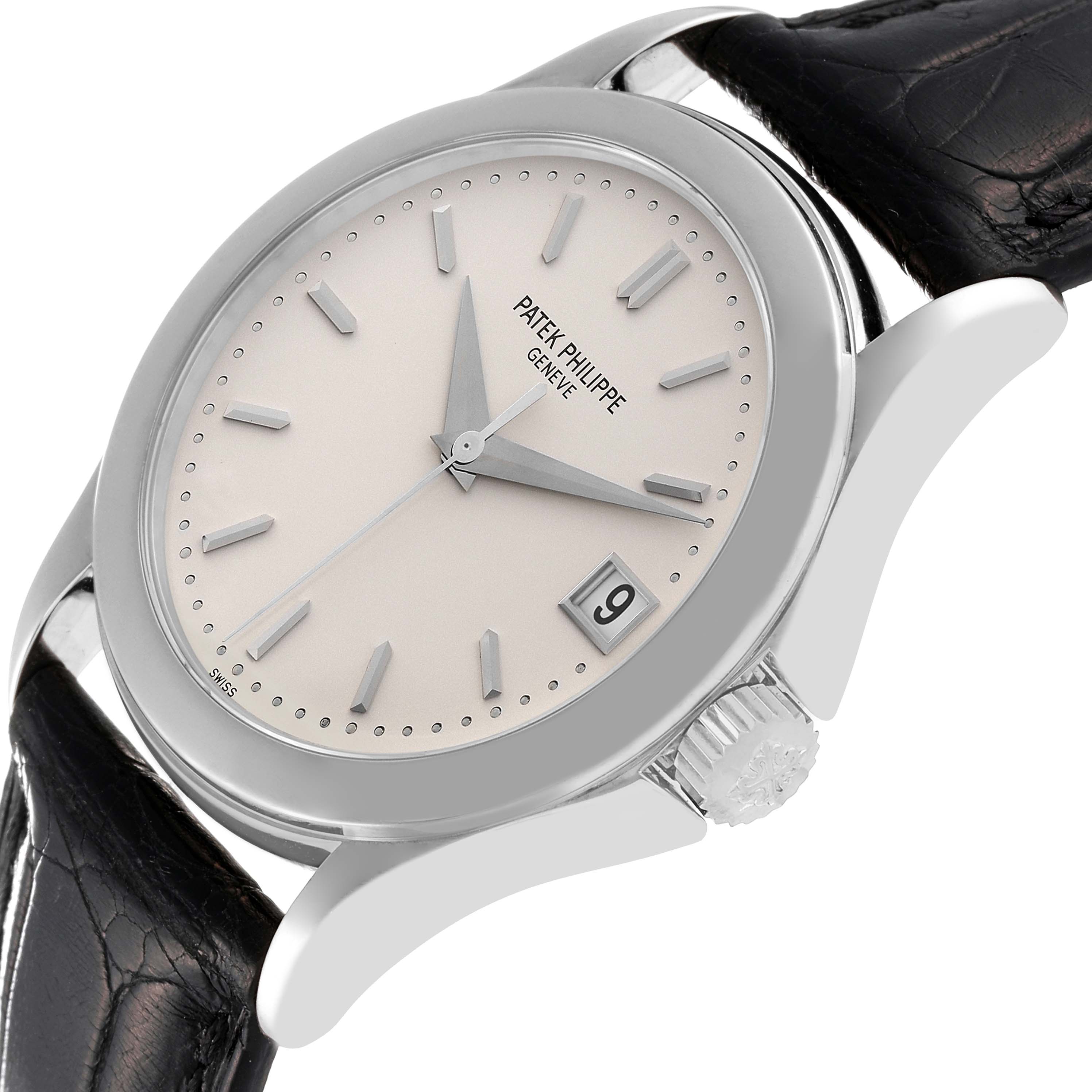 The image shows a Patek Philippe Calatrava 5107G Men's White Gold Silver Dial 5107G Men's White Gold Silver Dial watch at an angle, highlighting the dial, date window, crown, and leather strap.