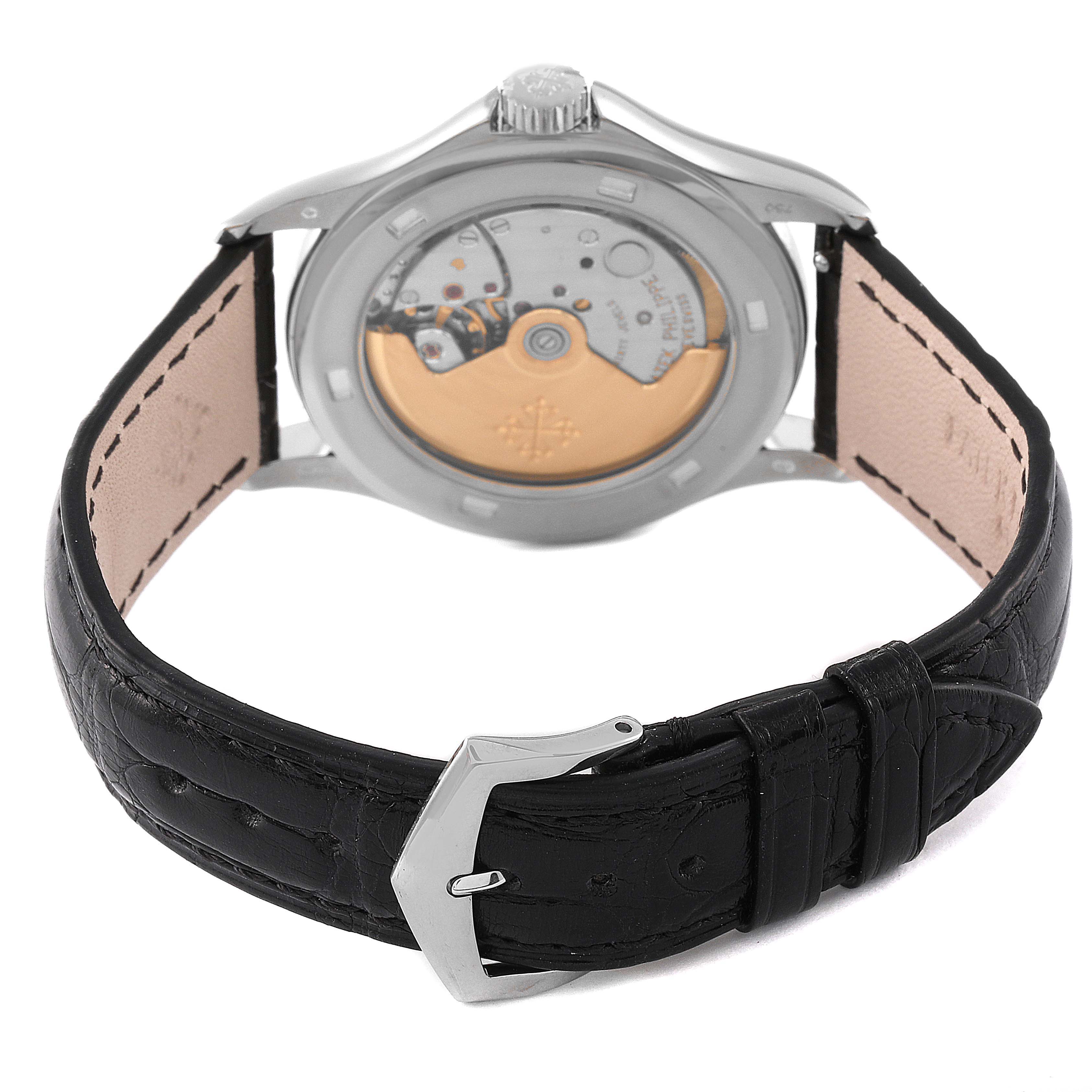 The image shows the back view of a Patek Philippe Calatrava 5107G Men's White Gold Silver Dial 5107G Men's White Gold Silver Dial watch, displaying its movement and black leather strap.