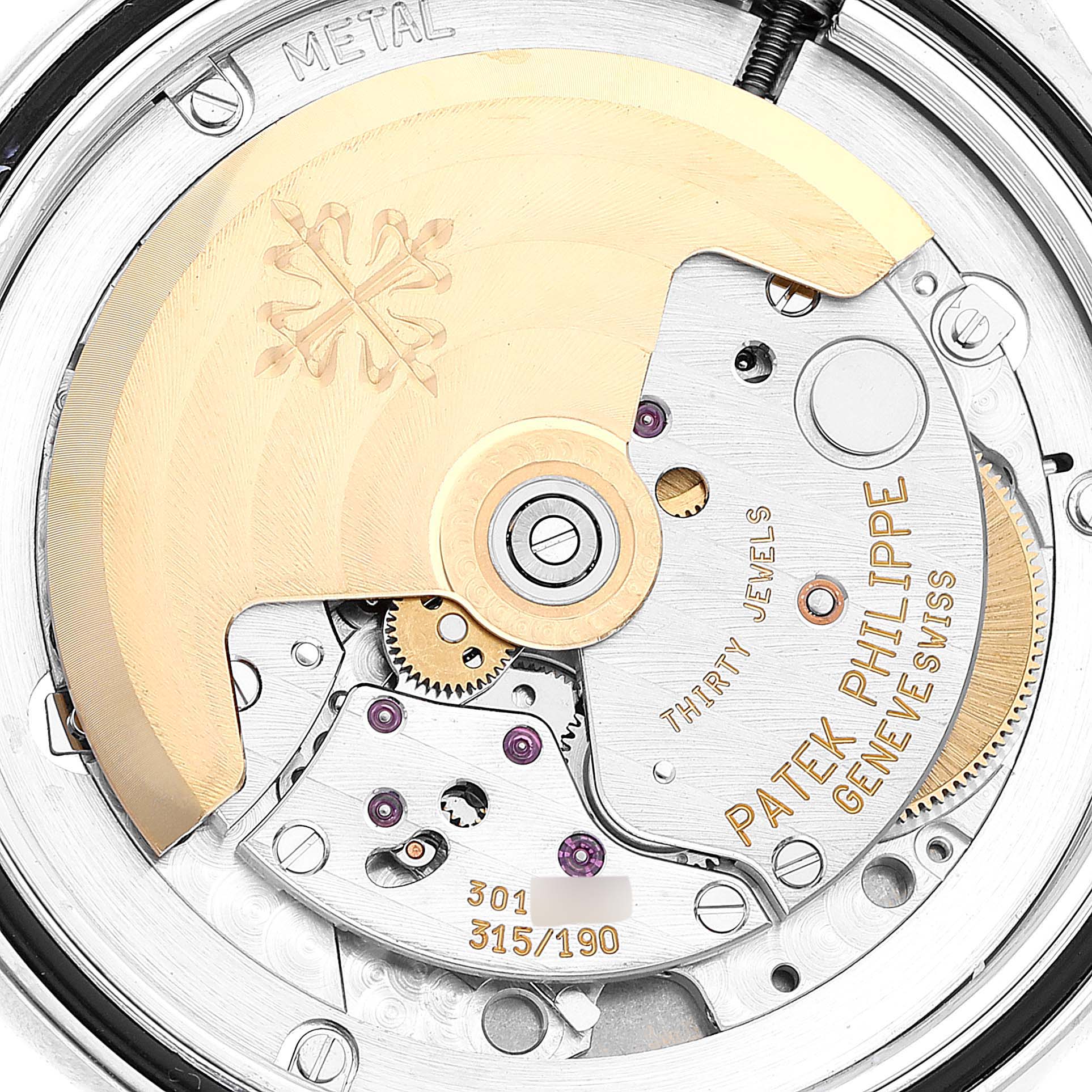 The image shows the intricate movement mechanism of a Patek Philippe Calatrava 5107G Men's White Gold Silver Dial 5107G Men's White Gold Silver Dial watch, viewed from the back.