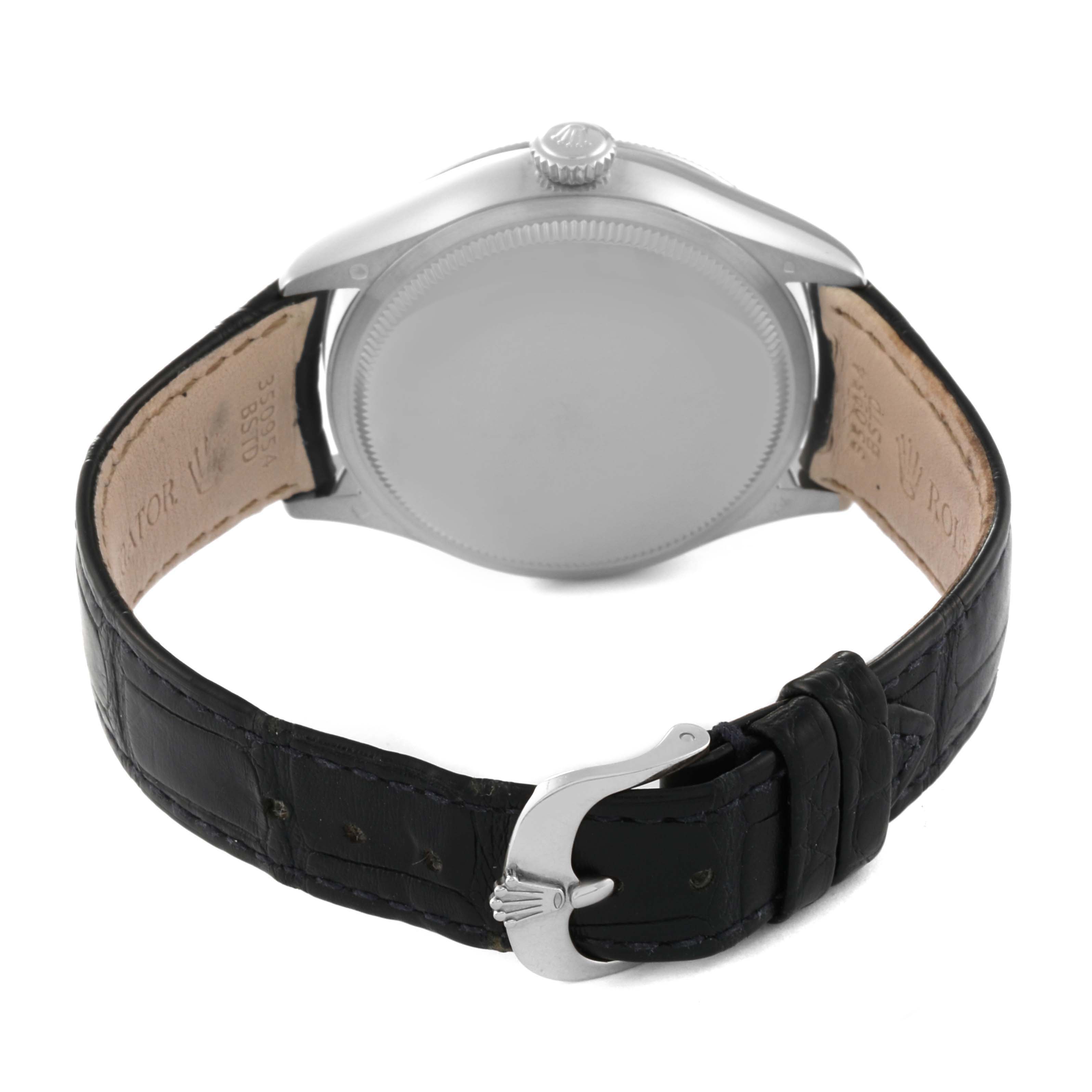 The image shows the back view of a Rolex Cellini 50519 Men
s White Gold Blue Dial 50519 Men
s White Gold Blue Dial watch, highlighting the case back, crown, and leather strap with buckle.