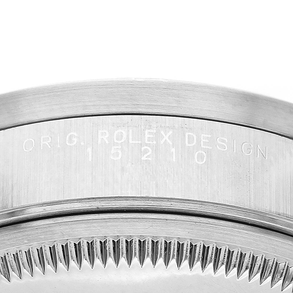 The image shows a close-up of the side of a Rolex Date 15210 Men's Stainless Steel Blue Dial model, featuring the engraved design number and part of the bezel.