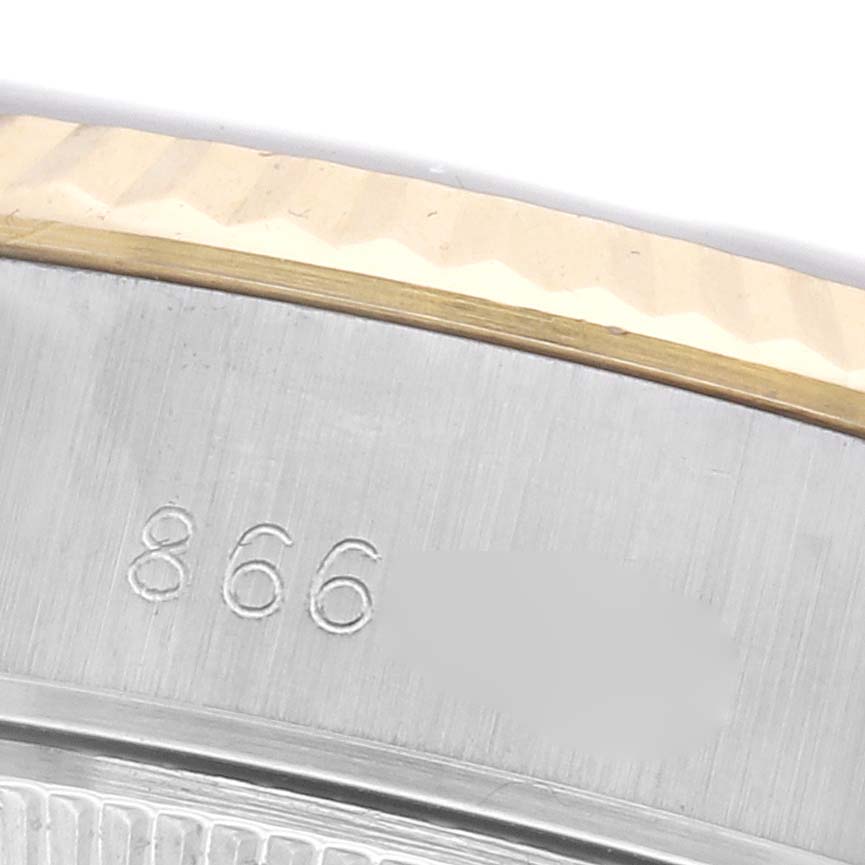 The image shows a close-up of the side of a Rolex Date 69173 Women's Steel and Gold (two tone) Black Dial 69173 Women's Steel and Gold (two tone) Black Dial model, focusing on the engraved numbers and bezel details.