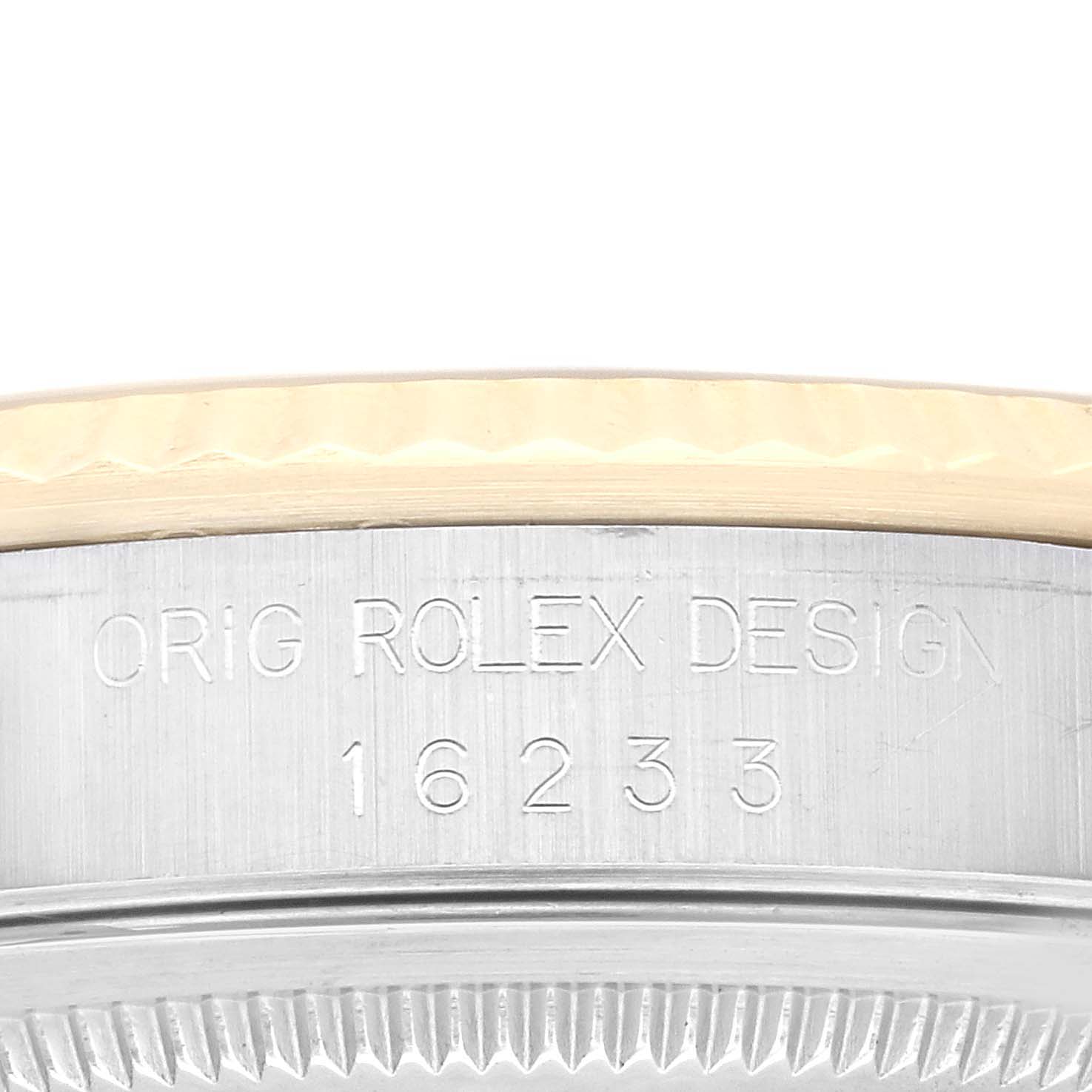 This is a close-up of the case edge, showing the model number and "Orig Rolex Design" engraving on a Rolex Datejust 16233 Men's Steel and Gold (two tone) Champagne Dial 16233 Men's Steel and Gold (two tone) Champagne Dial watch.