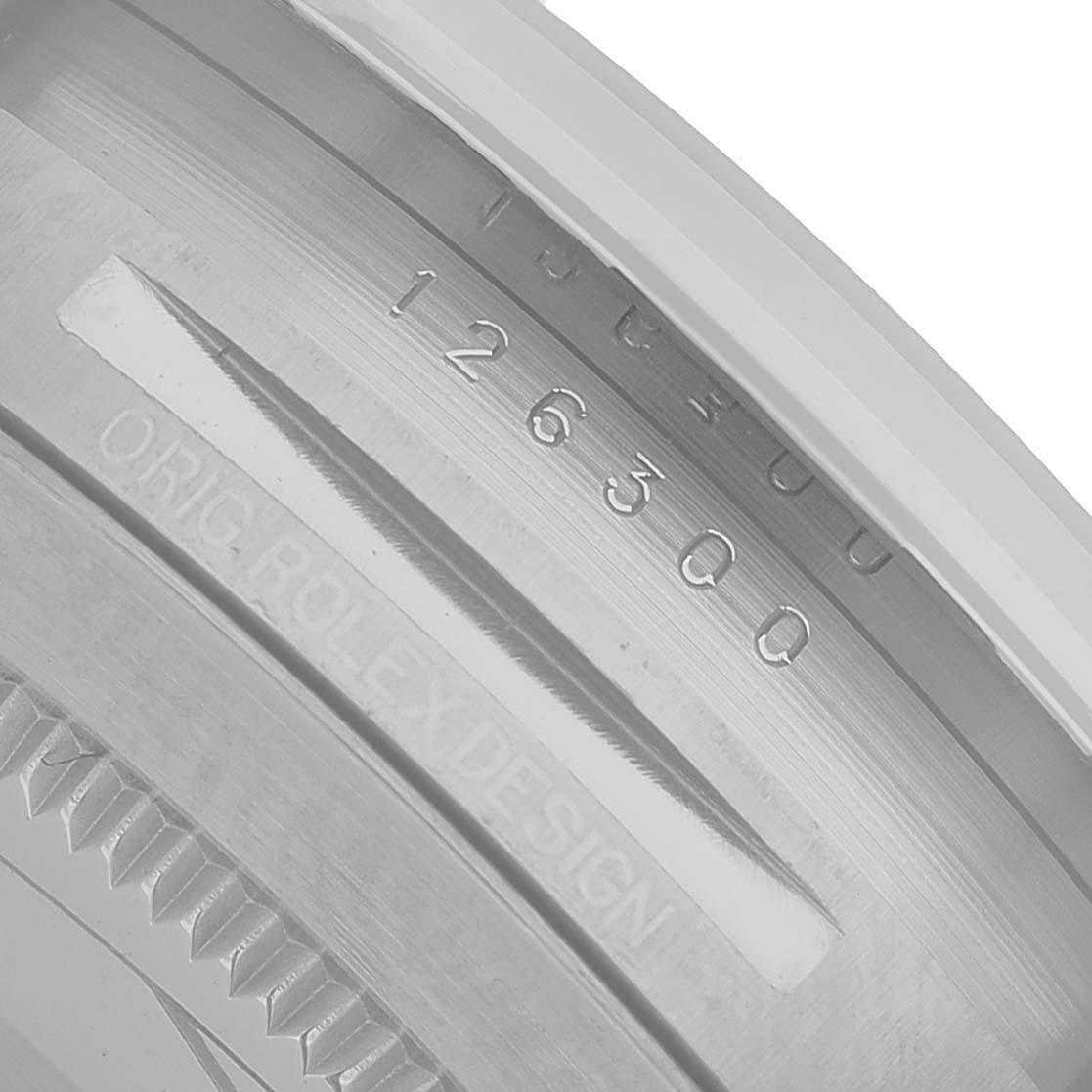 The image shows a close-up of the inner bezel of the Rolex Datejust 41 126300 Men's Stainless Steel Silver Dial, highlighting the engraved model number.