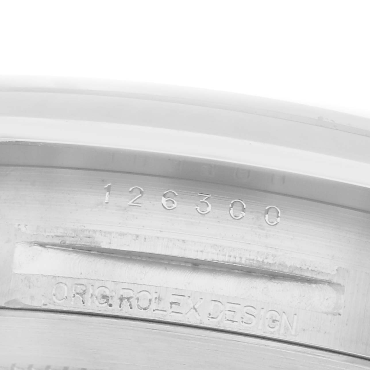 The image shows the inner bezel of a Rolex Datejust 41 126300 Men's Stainless Steel White Dial, featuring the model number and "ORIG ROLEX DESIGN" engraving.