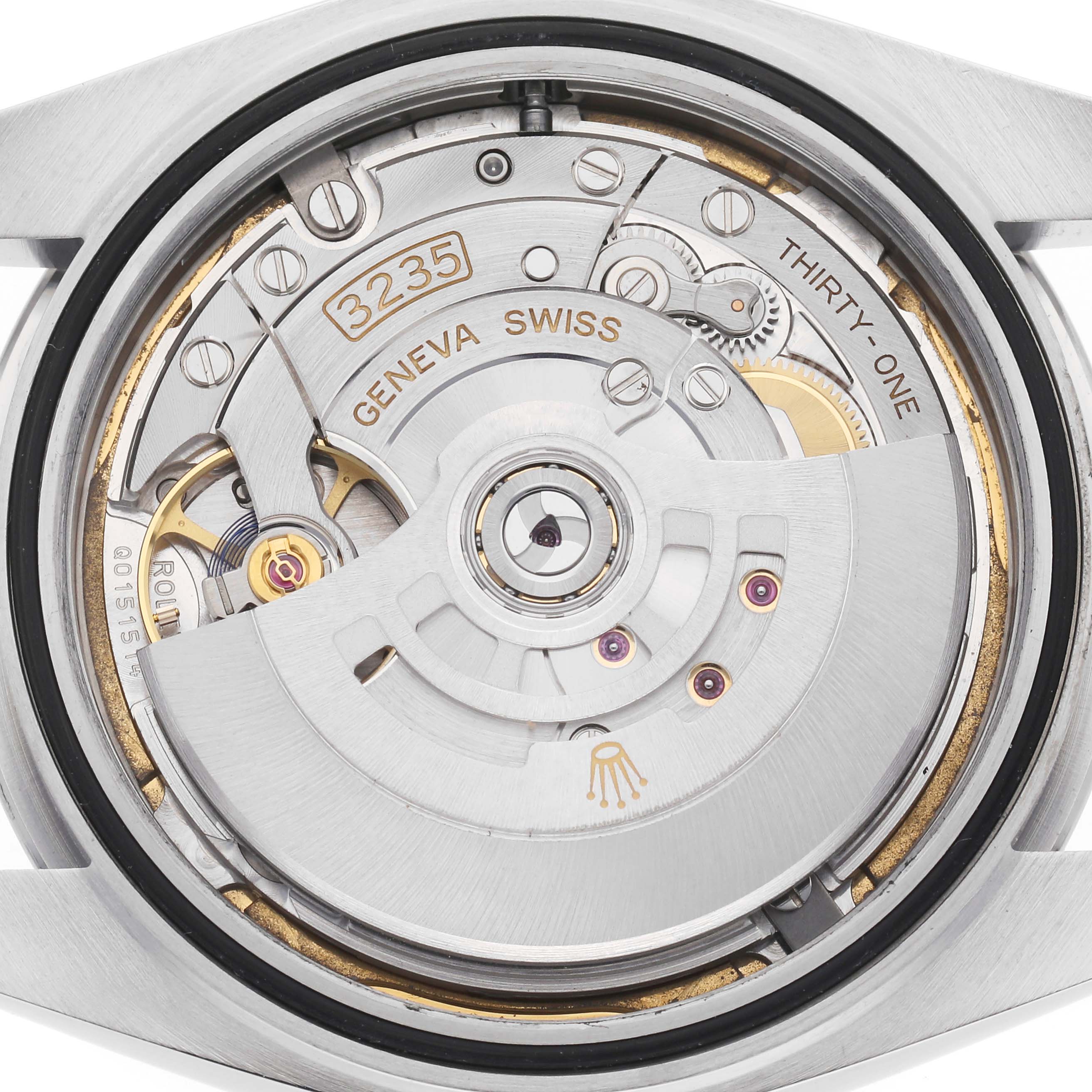 The image shows the movement of a Rolex Datejust 41 126300 Men's Stainless Steel White Dial, focusing on its intricate internal mechanisms from a back angle.