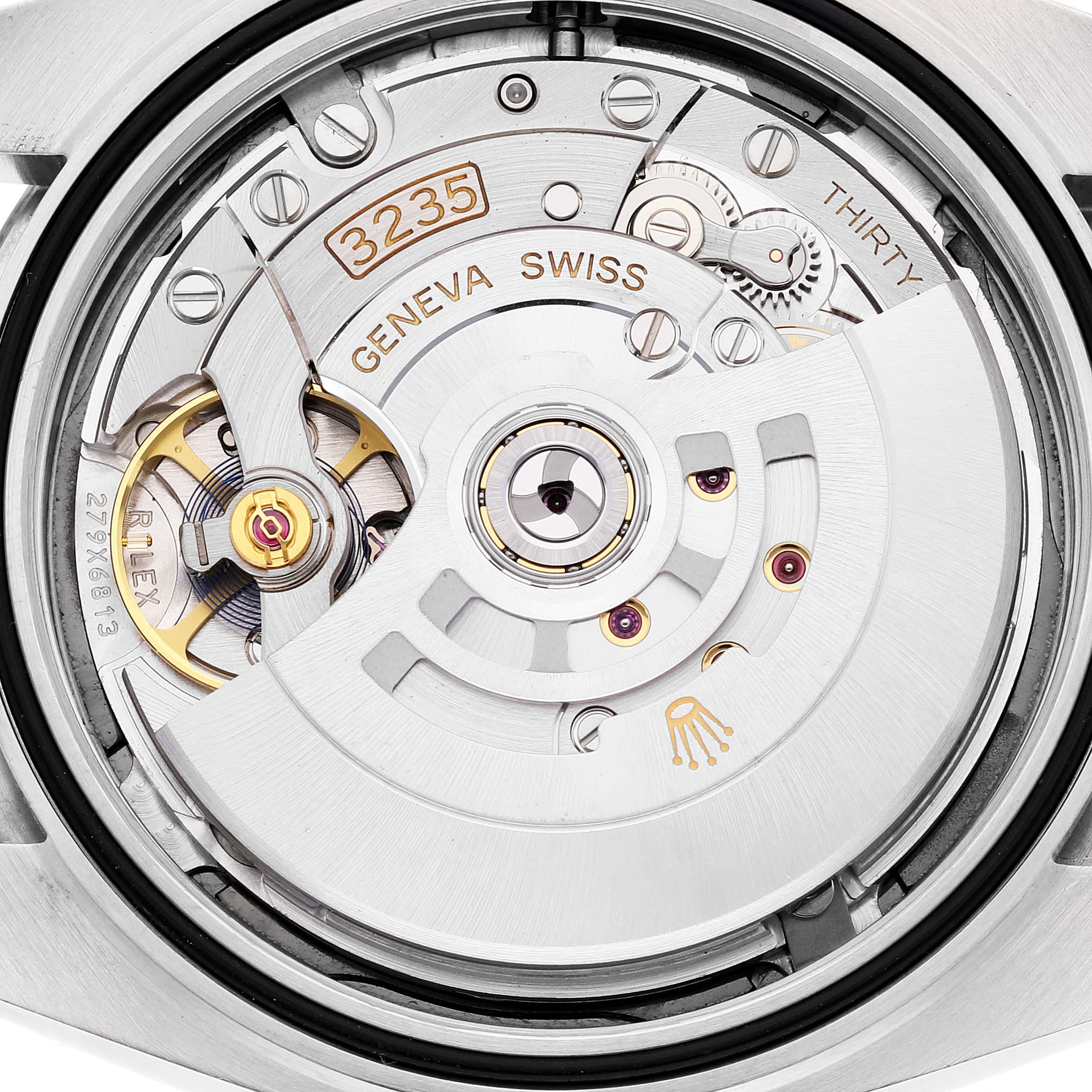 The image shows the movement of a Rolex Datejust 41 126334 Men's Stainless Steel Grey Dial, with visible gears and a rotor from a top-down angle.