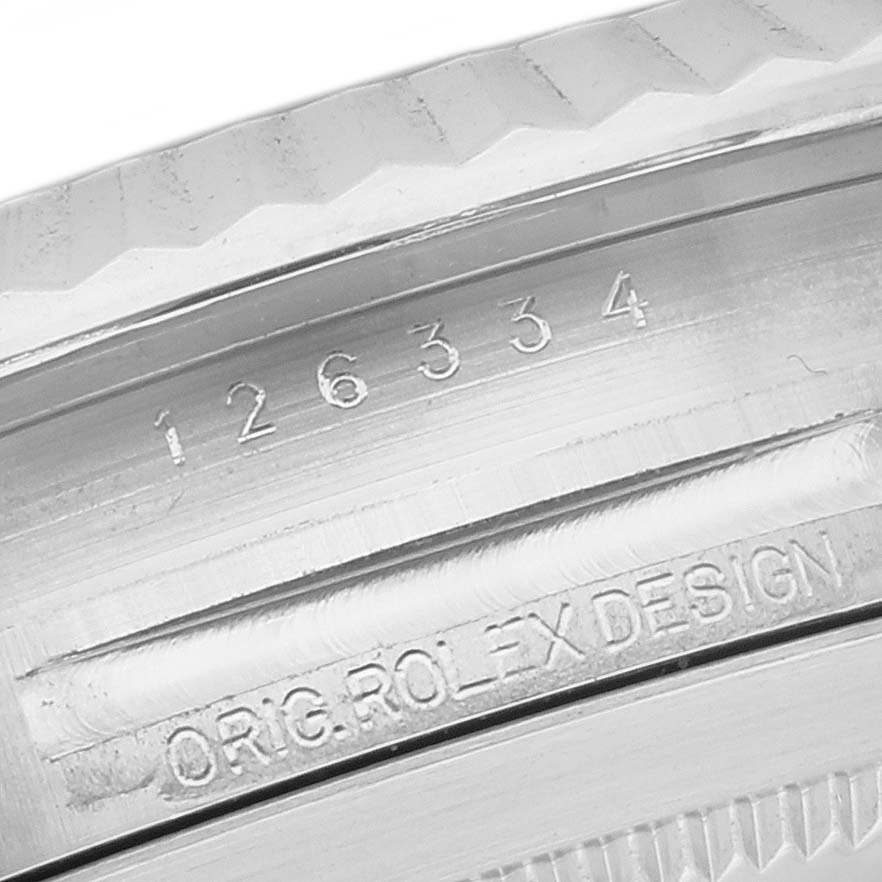The image shows a close-up of the Rolex Datejust 41 126334 Men's Stainless Steel Grey Dial model's case edge, displaying its engraved model number and "ORIG ROLEX DESIGN."