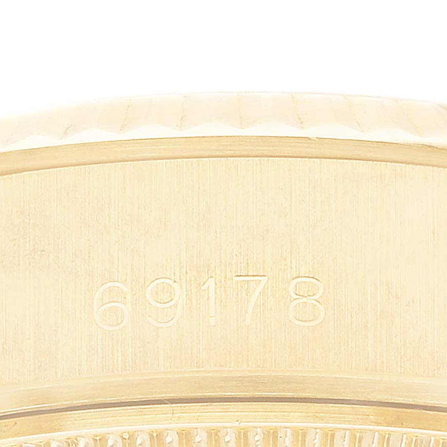 This image shows a close-up of the Rolex President 69178 Women
s Yellow Gold Champagne Dial 69178 Women
s Yellow Gold Champagne Dial model 69178 case side, highlighting the engraved model number.
