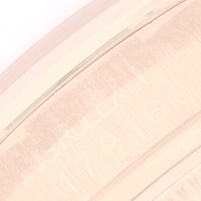 The image shows a close-up of the engraved caseback's inner edge of the Rolex President 179165 Women's Rose Gold White Dial 179165 Women's Rose Gold White Dial model watch.
