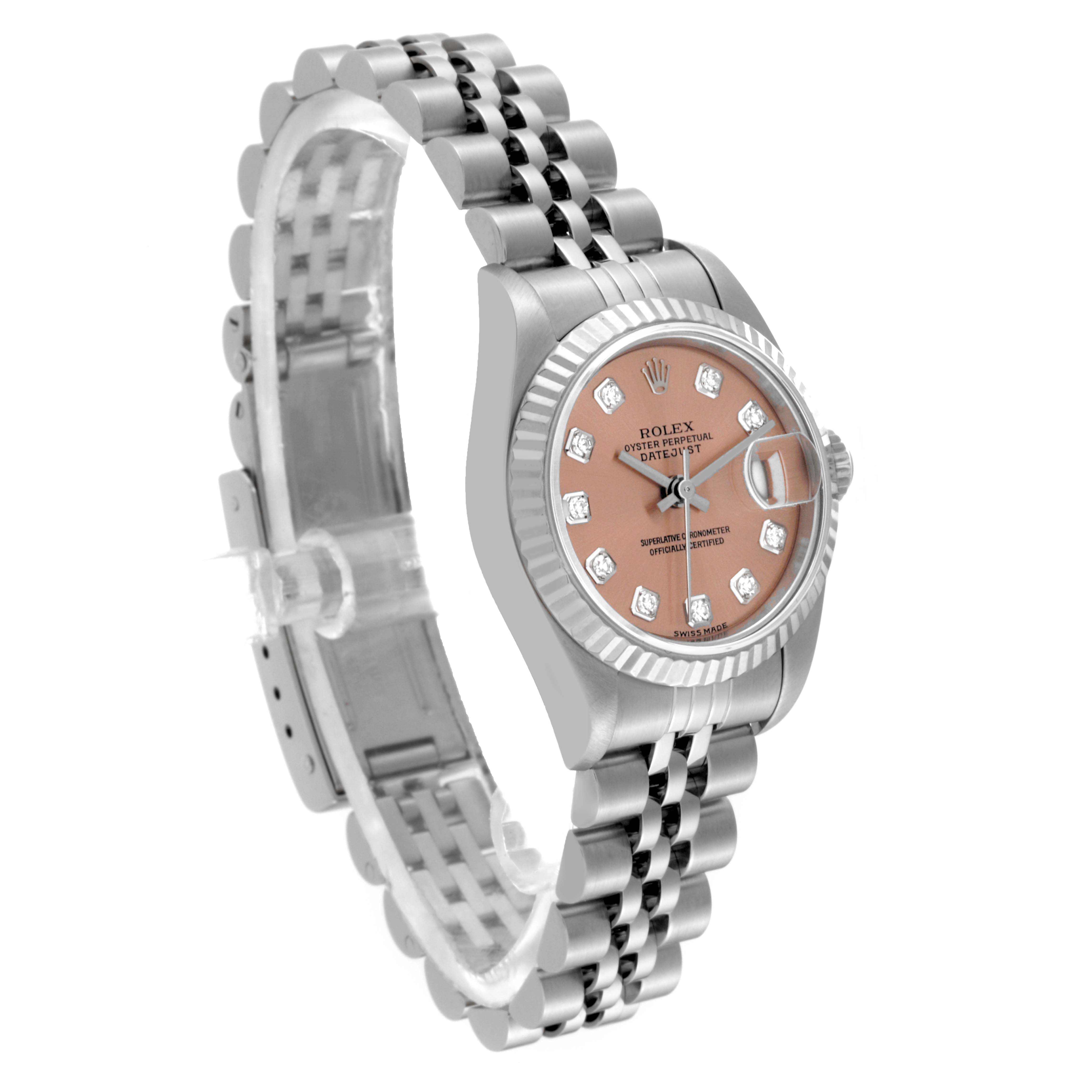 The image shows a side angle of a Rolex Datejust 79174 Women's Stainless Steel Pink Dial 79174 Women's Stainless Steel Pink Dial watch, highlighting its face, bezel, and partially extended bracelet.