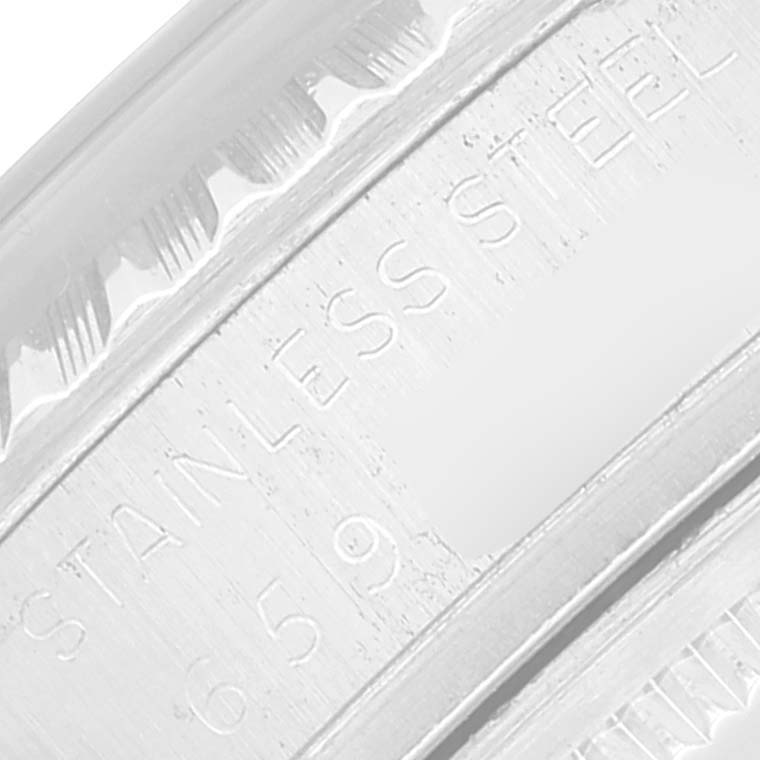 The image shows a close-up of the stainless steel engraving on the bezel or inner case of a Rolex Datejust 16030 Men's Stainless Steel Silver Dial 16030 Men's Stainless Steel Silver Dial watch.