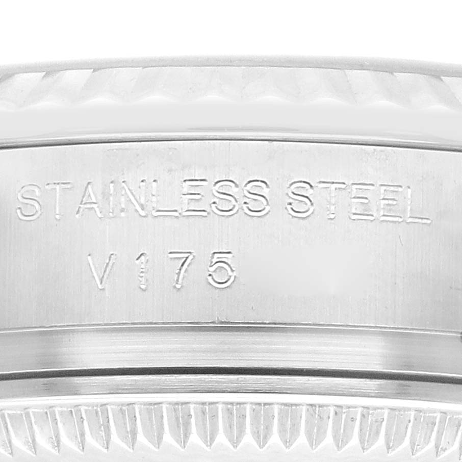 This close-up image shows the engraving on the stainless steel case of a Rolex Datejust 179174 Women's Stainless Steel Black Dial 179174 Women's Stainless Steel Black Dial watch.