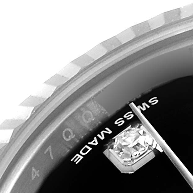 This close-up shot of a Rolex Datejust 179174 Women's Stainless Steel Black Dial 179174 Women's Stainless Steel Black Dial watch shows part of the dial, a diamond marker, and "Swiss Made" text.