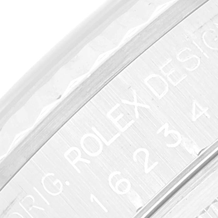 This image shows a close-up of the side details, including the engraved "Rolex Design" and model number, of a Rolex Datejust 16234 Men's Stainless Steel White Dial 16234 Men's Stainless Steel White Dial watch.