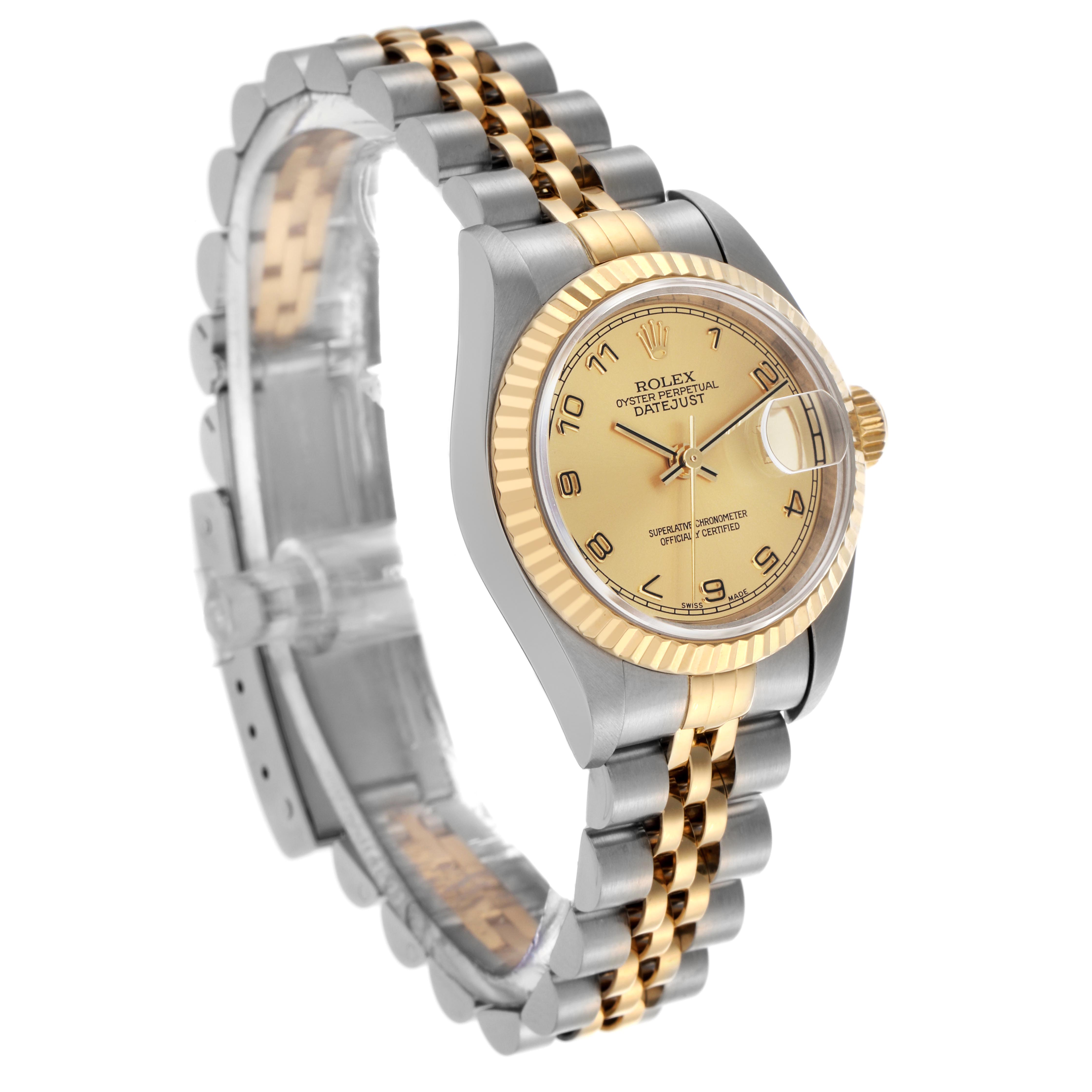 The Rolex Datejust 79173 Women's Steel and Gold (two tone) Champagne Dial 79173 Women's Steel and Gold (two tone) Champagne Dial watch is shown at a three-quarter angle, highlighting the gold bezel, dial, and two-tone bracelet.