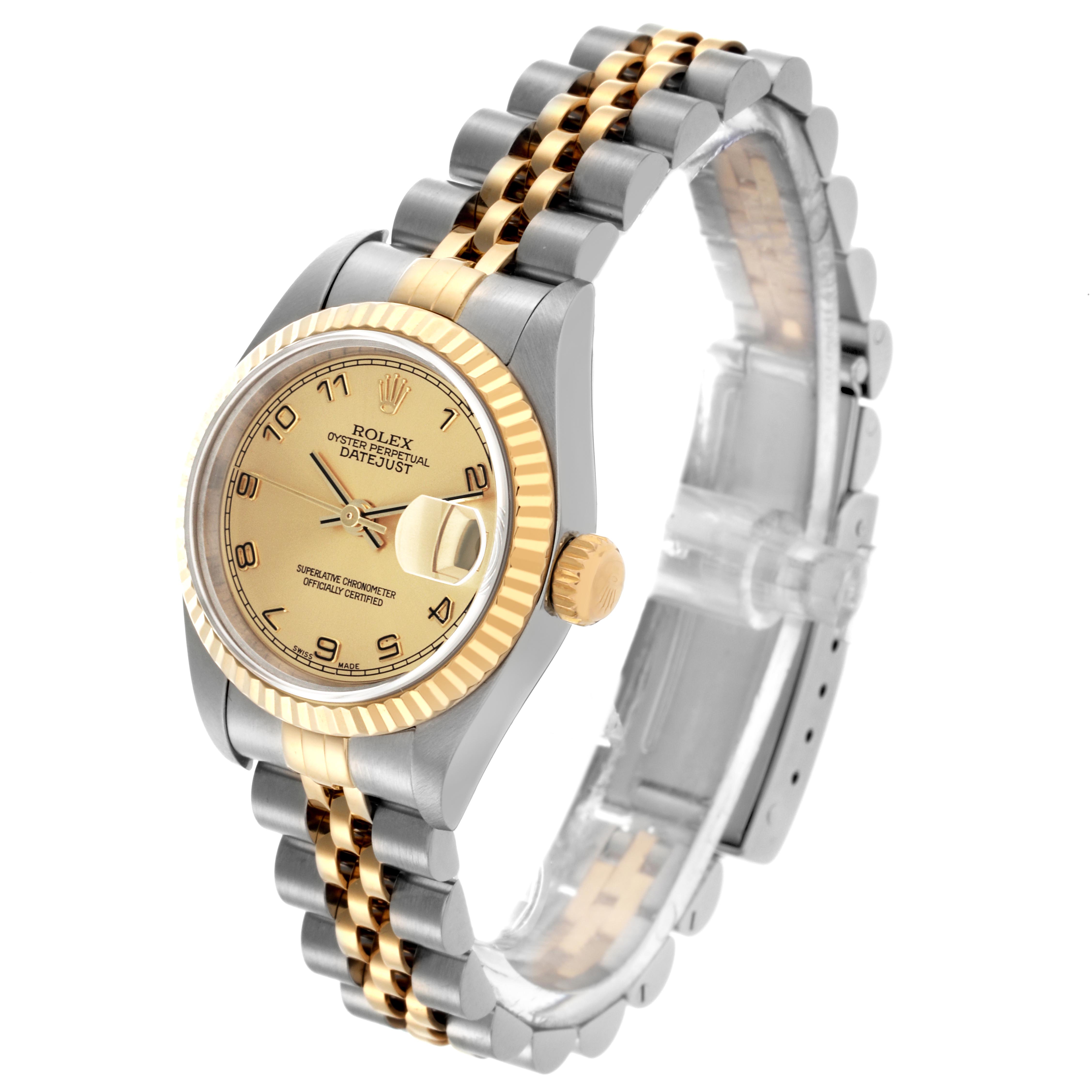 The Rolex Datejust 79173 Women's Steel and Gold (two tone) Champagne Dial 79173 Women's Steel and Gold (two tone) Champagne Dial watch is shown at an angled side view, highlighting the gold bezel, crown, dial, and two-tone bracelet.