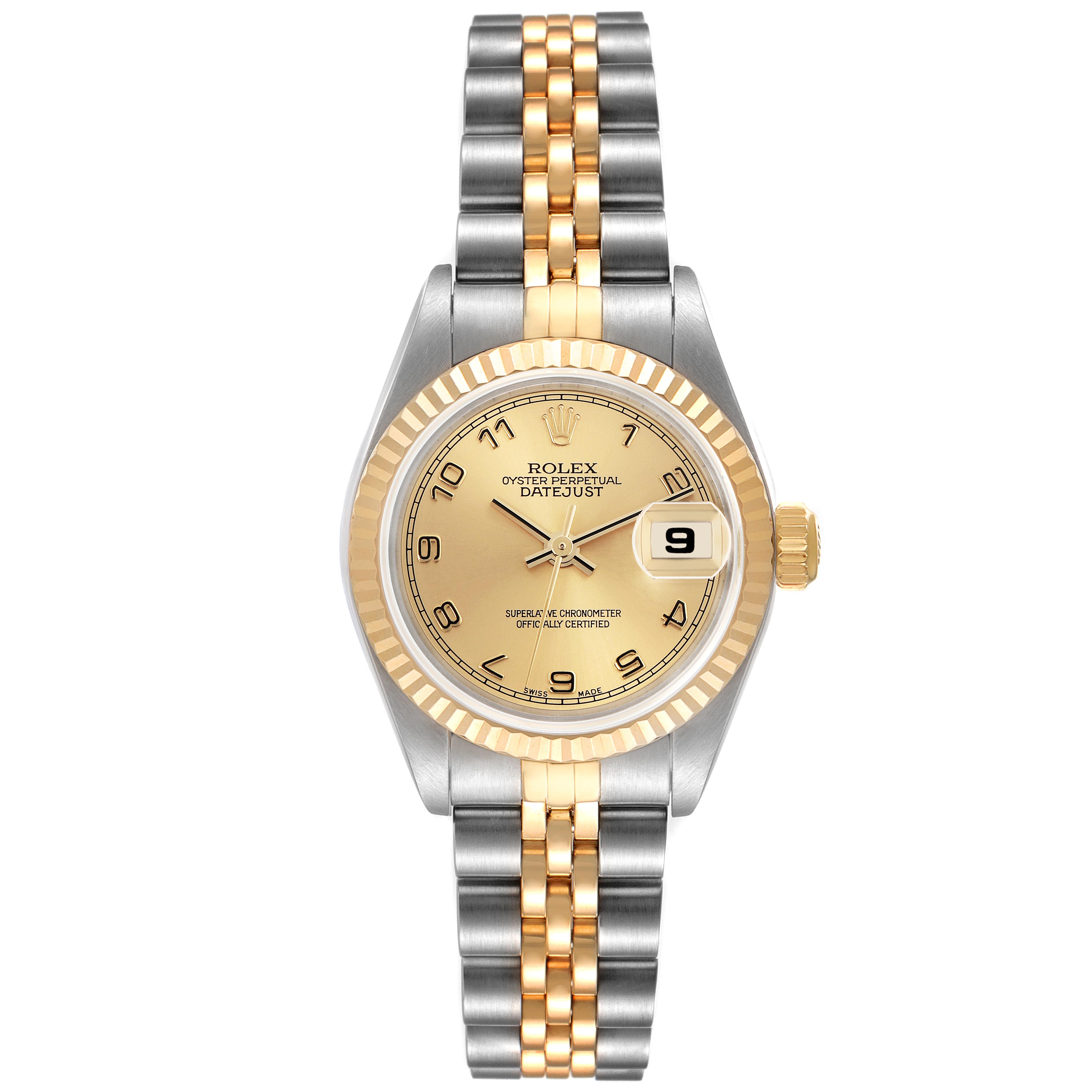 The Rolex Datejust 79173 Women's Steel and Gold (two tone) Champagne Dial 79173 Women's Steel and Gold (two tone) Champagne Dial watch is shown from a top-down angle, highlighting its gold dial, fluted bezel, and Jubilee bracelet.