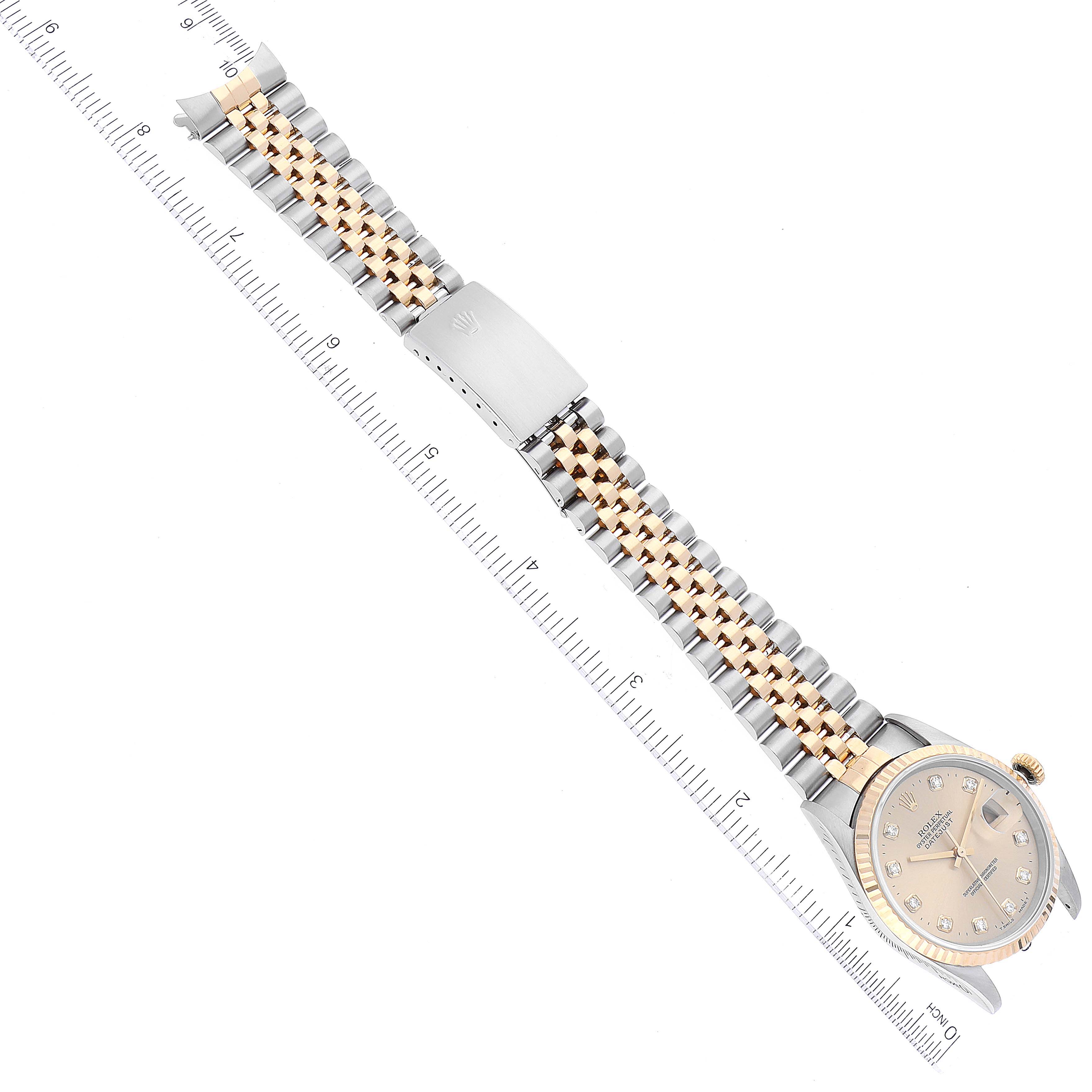 This image shows a top-down view of a Rolex Datejust 16233 Men's Steel and Gold (two tone) Champagne Dial 16233 Men's Steel and Gold (two tone) Champagne Dial watch, highlighting its dial, bezel, and two-tone bracelet.