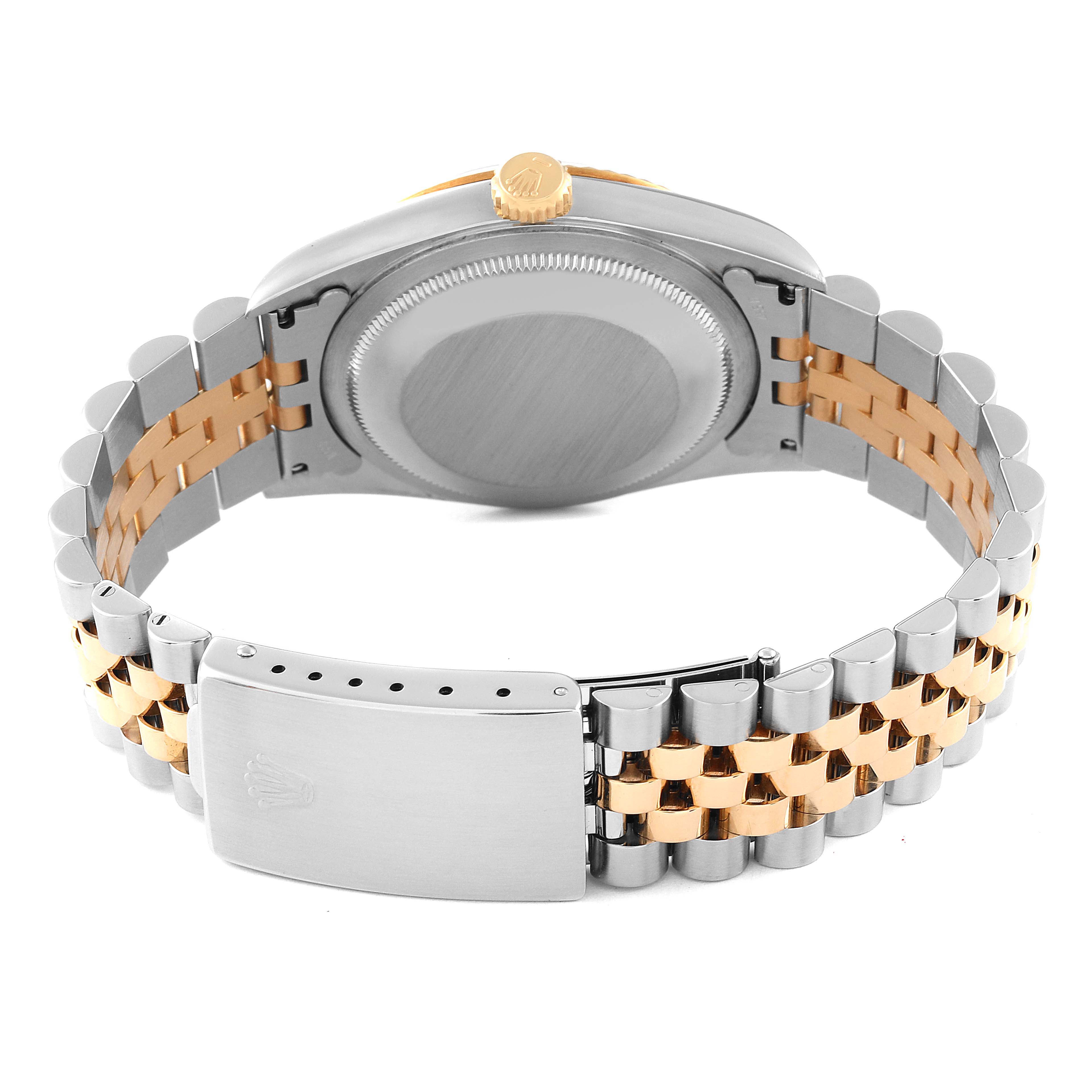 The image shows the back view of a Rolex Datejust 16233 Men's Steel and Gold (two tone) Champagne Dial 16233 Men's Steel and Gold (two tone) Champagne Dial watch, focusing on its case, crown, and two-tone Jubilee bracelet.