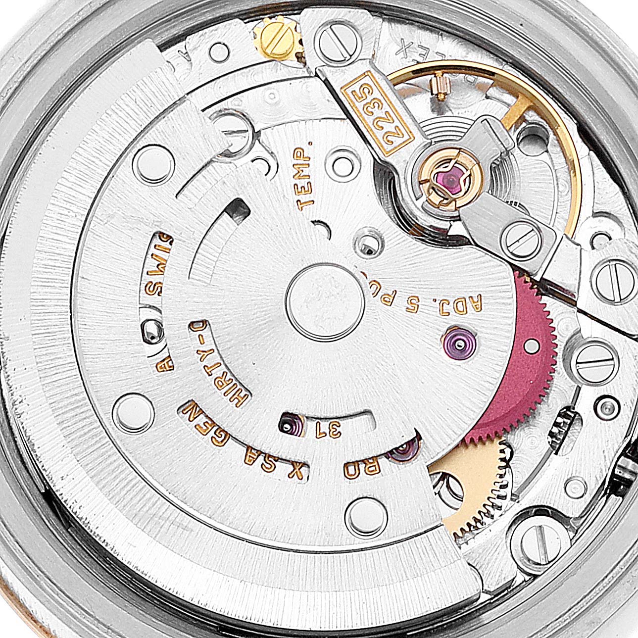 The image shows a close-up view of the mechanical movement inside a Rolex Datejust 79173 Women's Steel and Gold (two tone) Grey Dial 79173 Women's Steel and Gold (two tone) Grey Dial watch, highlighting gears and components.
