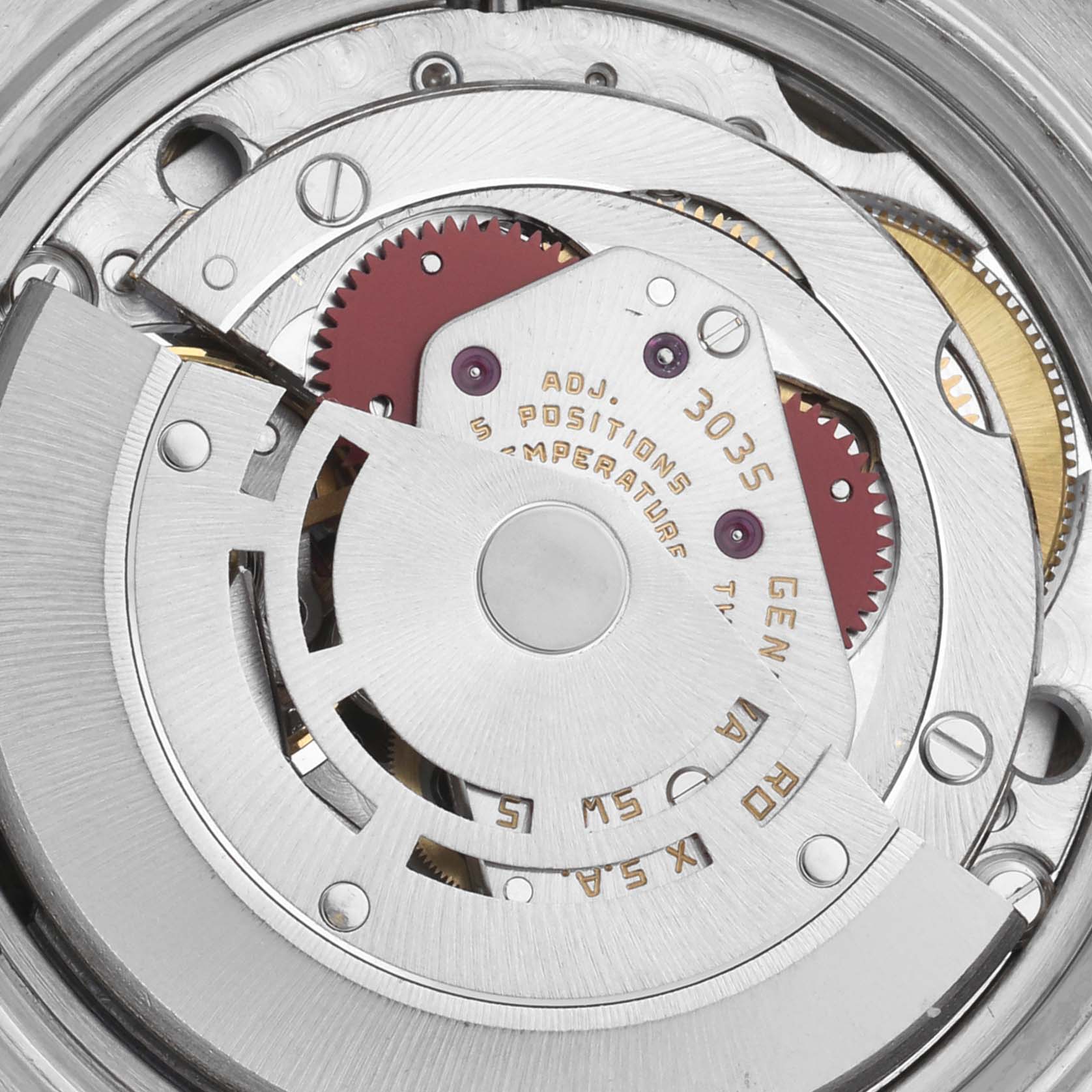 The image shows the movement of a Rolex Datejust 16013 Men's Steel and Gold (two tone) Champagne Dial 16013 Men's Steel and Gold (two tone) Champagne Dial watch from a top-down angle, highlighting gears and intricate components.