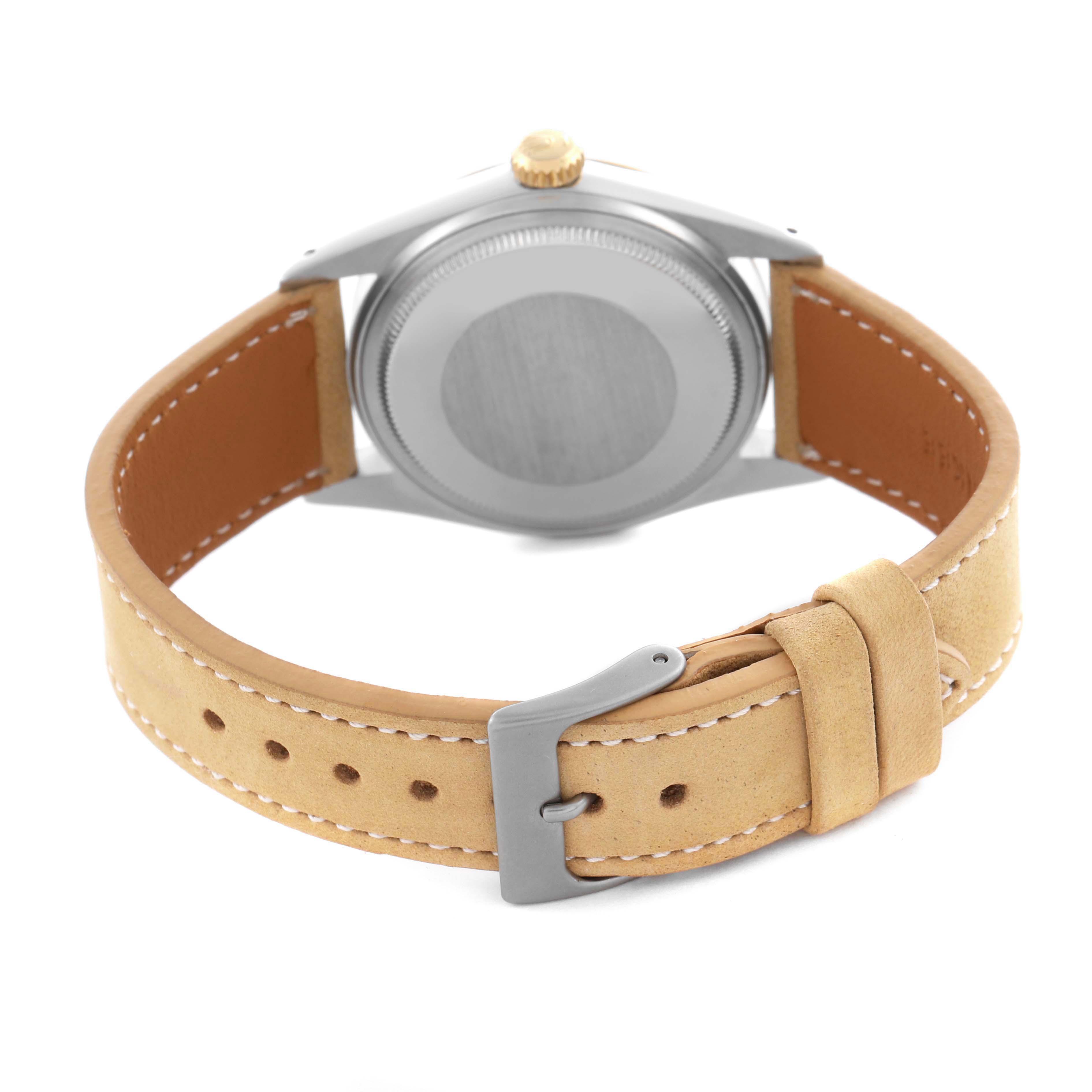 The image shows the back of a Rolex Datejust 16013 Men's Steel and Gold (two tone) Champagne Dial 16013 Men's Steel and Gold (two tone) Champagne Dial watch, featuring the case back, crown, and leather strap with a metal buckle.