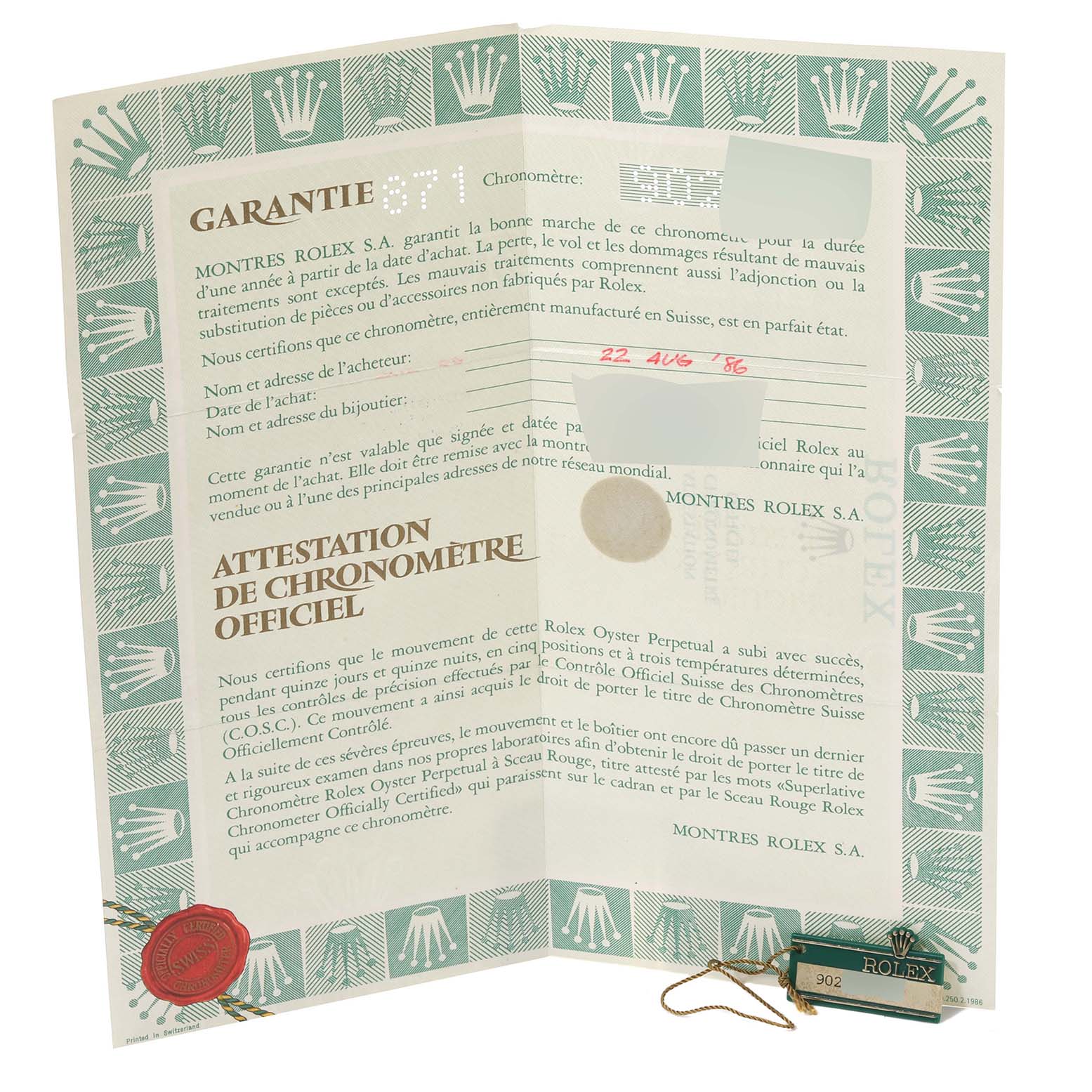 The image shows warranty paperwork and certificates for a Vintage Collection model by Rolex, including a tag and seal.