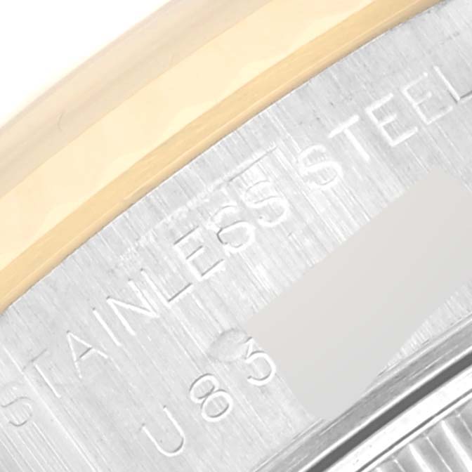 The image shows a close-up of the side and bezel of a Rolex Datejust 69173 Women's Steel and Gold (two tone) White Dial 69173 Women's Steel and Gold (two tone) White Dial watch, detailing the "STAINLESS STEEL" engraving.