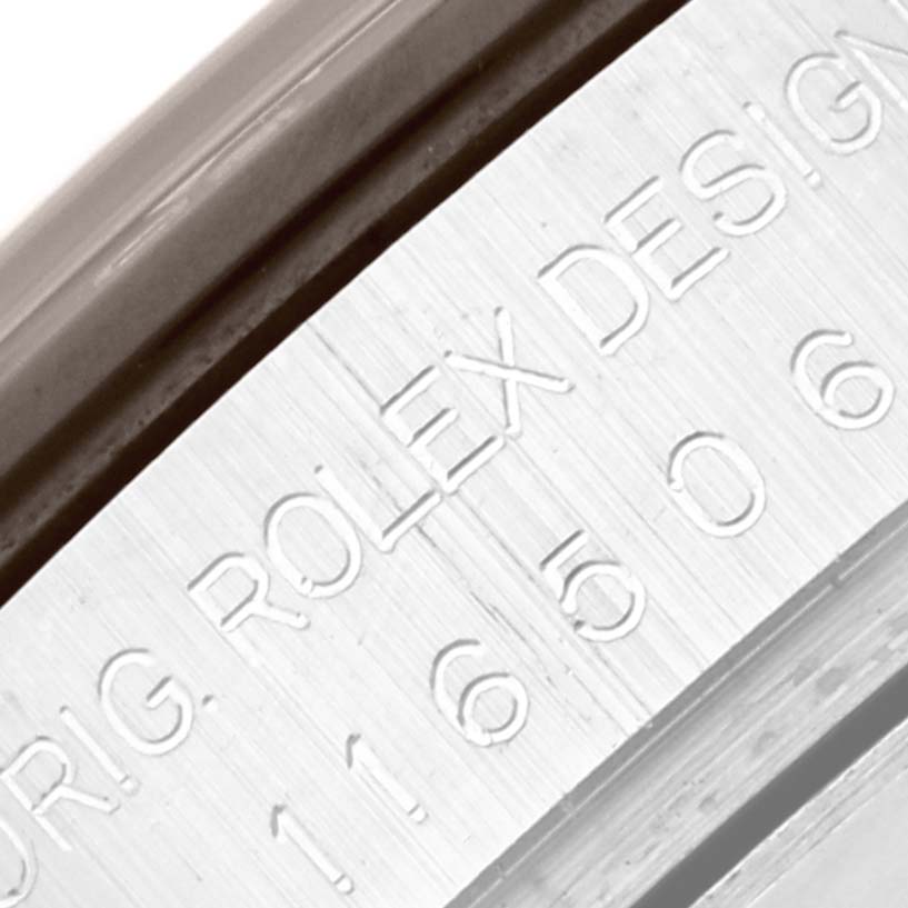 The image shows a close-up of the engraved serial number and brand marking on the case of a Rolex Daytona 116506 Men's Platinum Blue Dial 116506 Men's Platinum Blue Dial watch.
