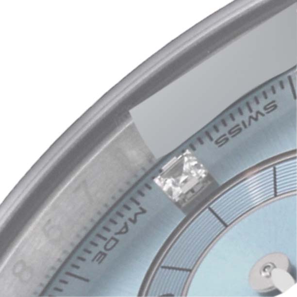 This image shows a close-up of the dial and bezel of a Rolex Daytona 116506 Men's Platinum Blue Dial 116506 Men's Platinum Blue Dial watch, with a diamond marker and Swiss inscription visible.